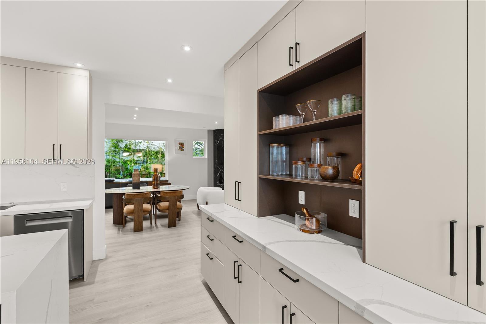3616 Southwest 26th Street Miami, FL 33133 - Photo 15 of 77 a kitchen with stainless steel appliances sink refrigerator and window