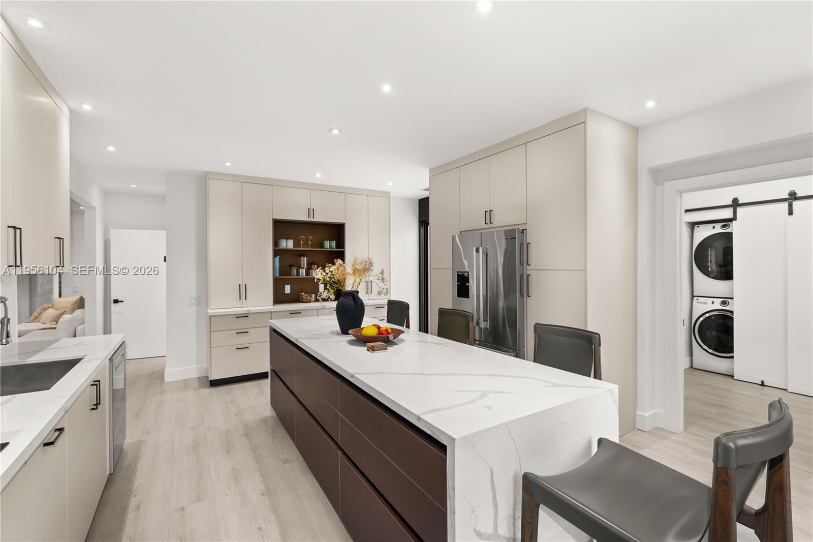 3616 Southwest 26th Street Miami, FL 33133 - Photo 20 of 77 a large kitchen with a table and refrigerator