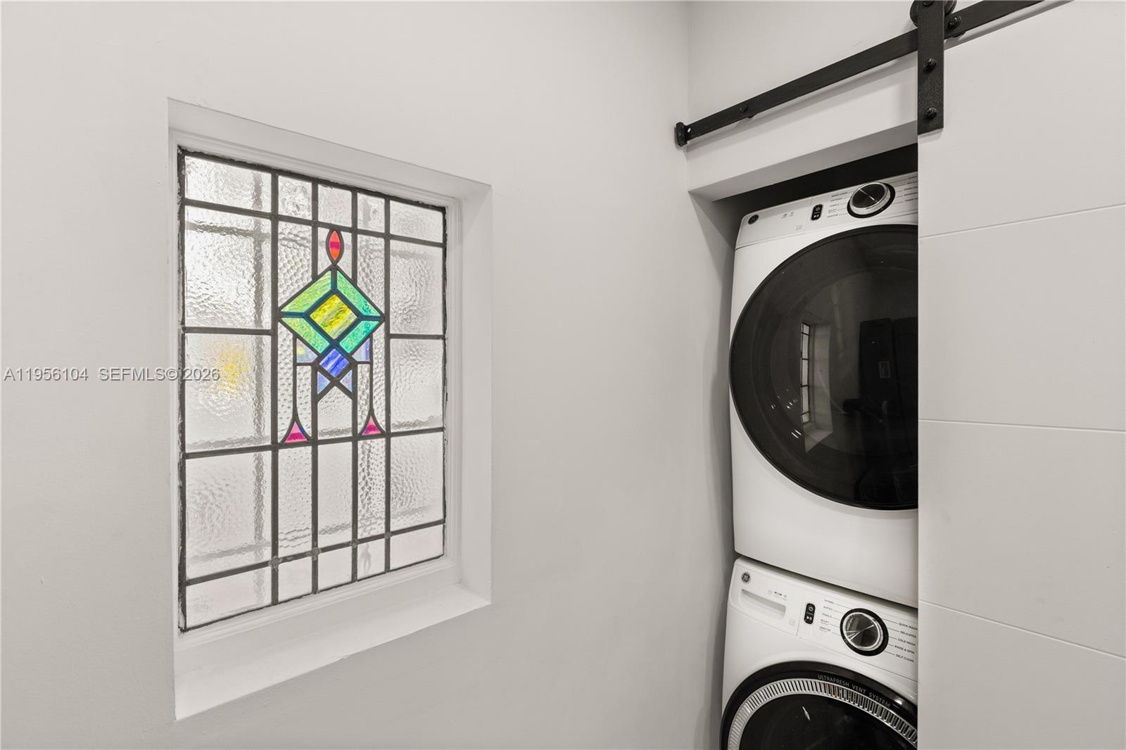 3616 Southwest 26th Street Miami, FL 33133 - Photo 23 of 77 a utility room with dryer and washer