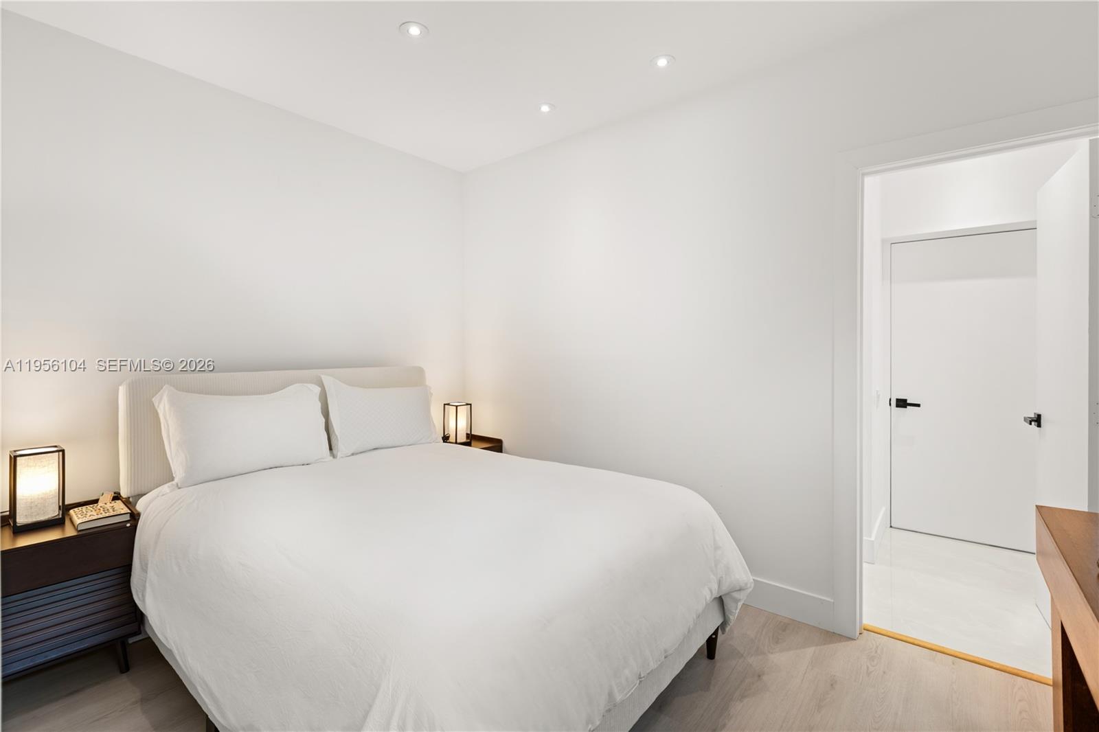 3616 Southwest 26th Street Miami, FL 33133 - Photo 34 of 77 a bedroom with a bed and a walk in closet