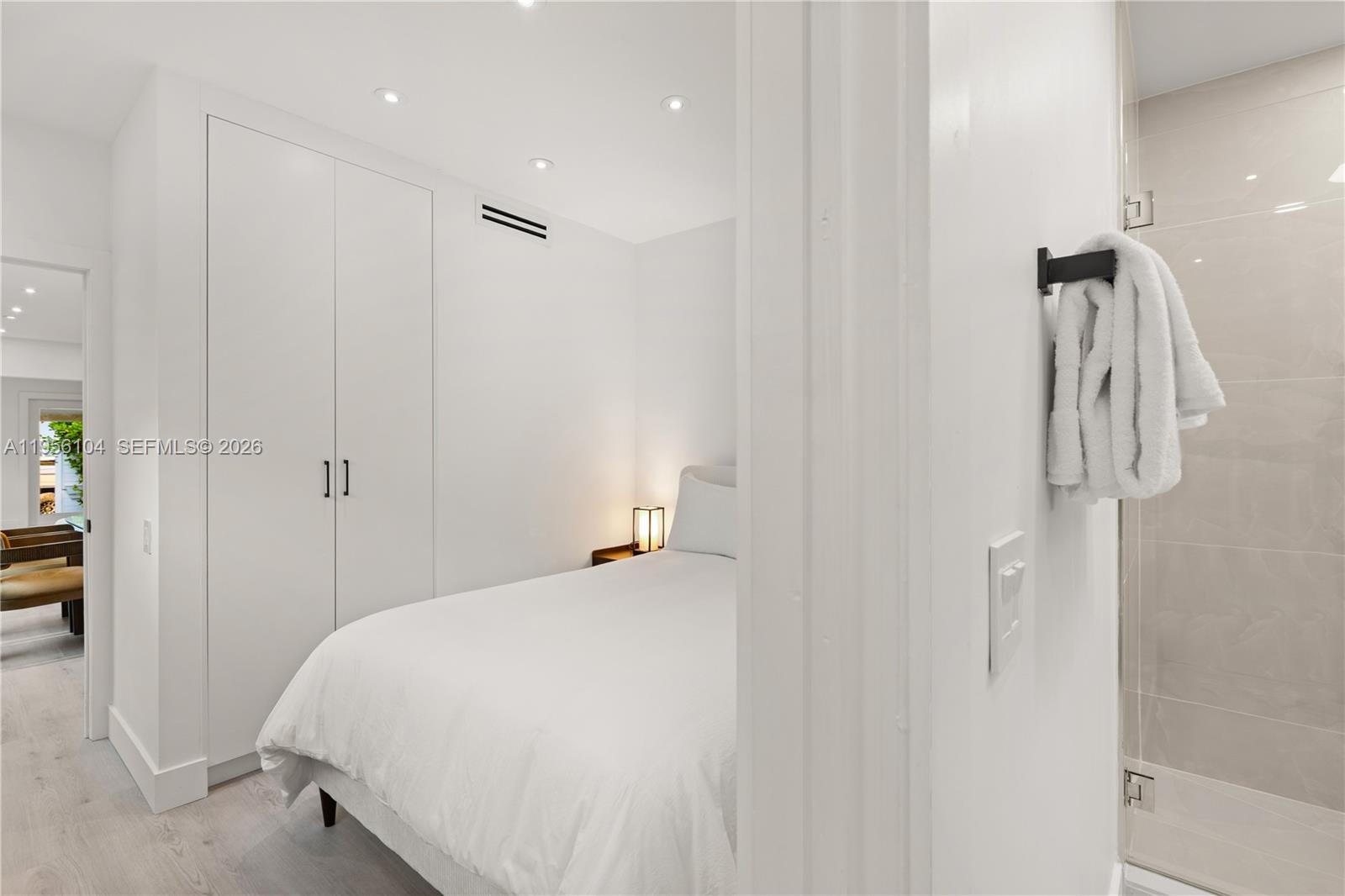 3616 Southwest 26th Street Miami, FL 33133 - Photo 36 of 77 a bedroom with a bed and a walk in closet