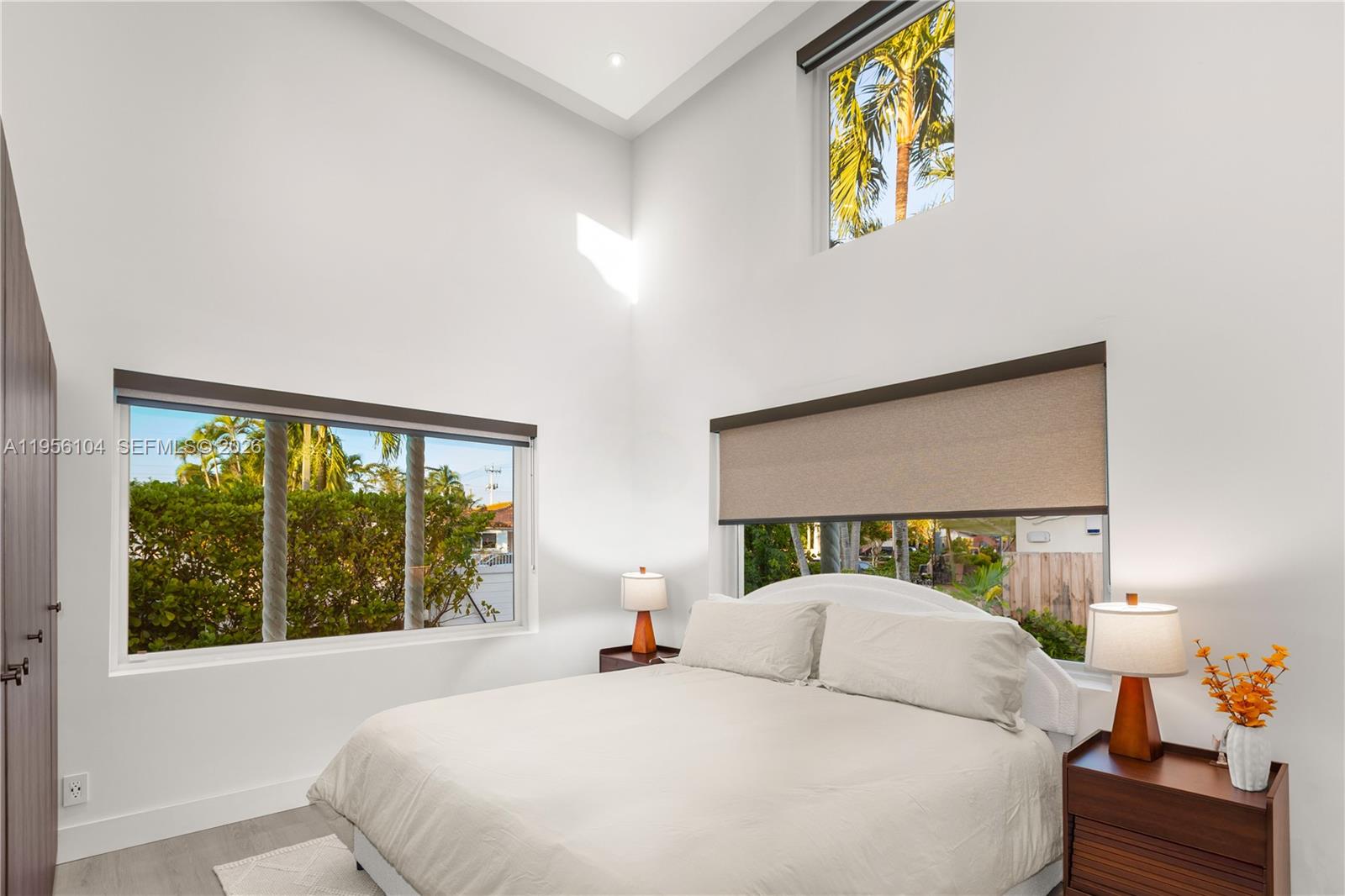 3616 Southwest 26th Street Miami, FL 33133 - Photo 39 of 77 a bedroom with a bed and a painting on the wall