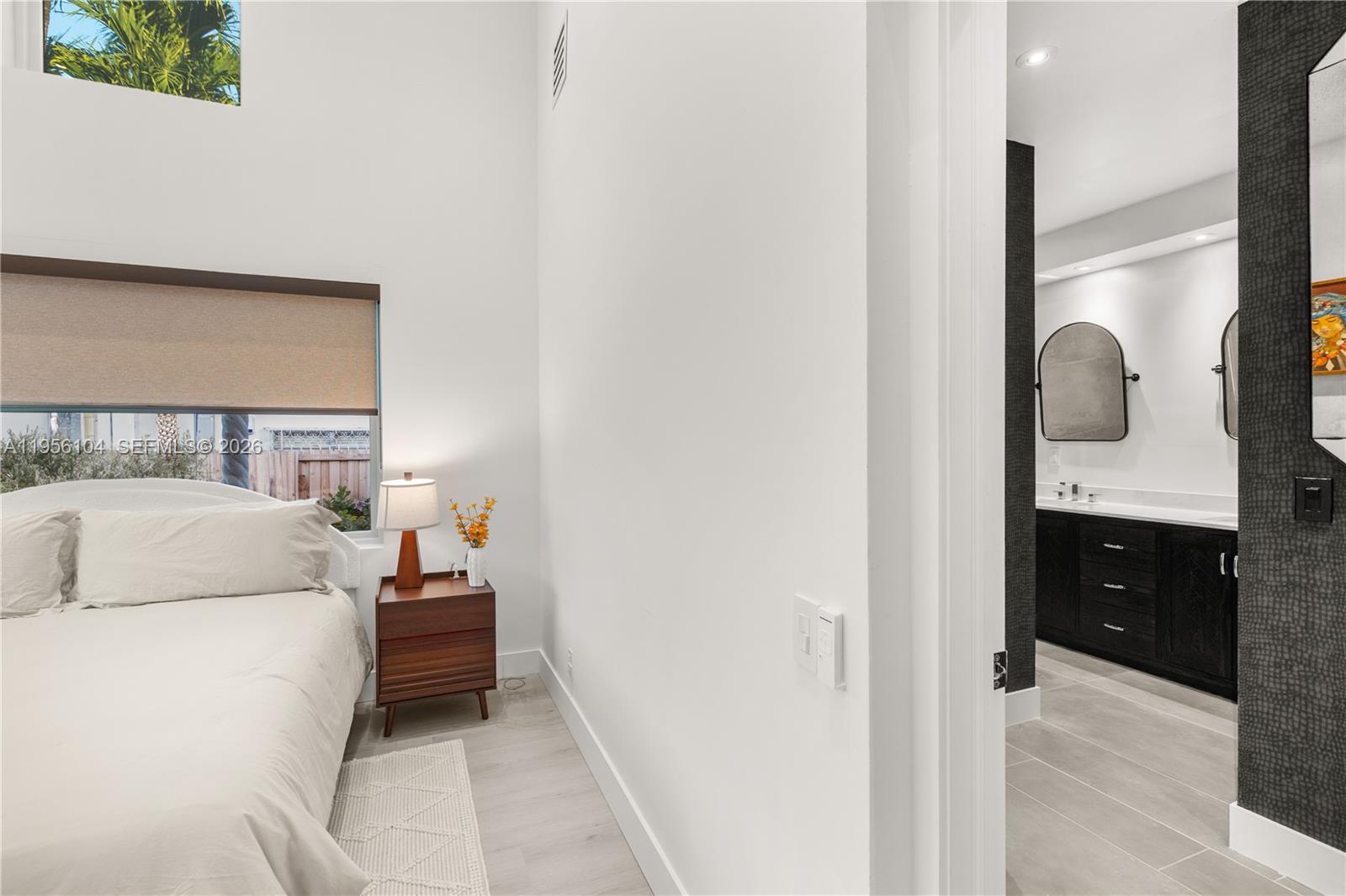 3616 Southwest 26th Street Miami, FL 33133 - Photo 41 of 77 a bed room with a bed and a television