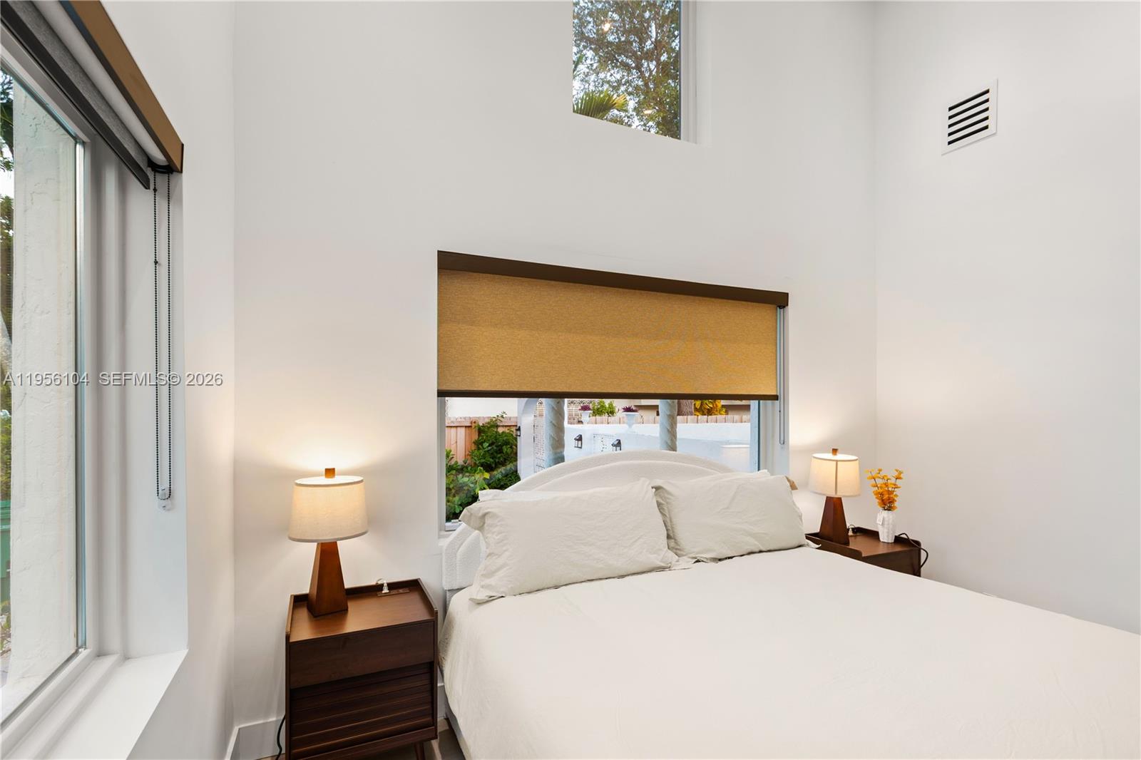 3616 Southwest 26th Street Miami, FL 33133 - Photo 47 of 77 a bedroom with a bed and a night lamp