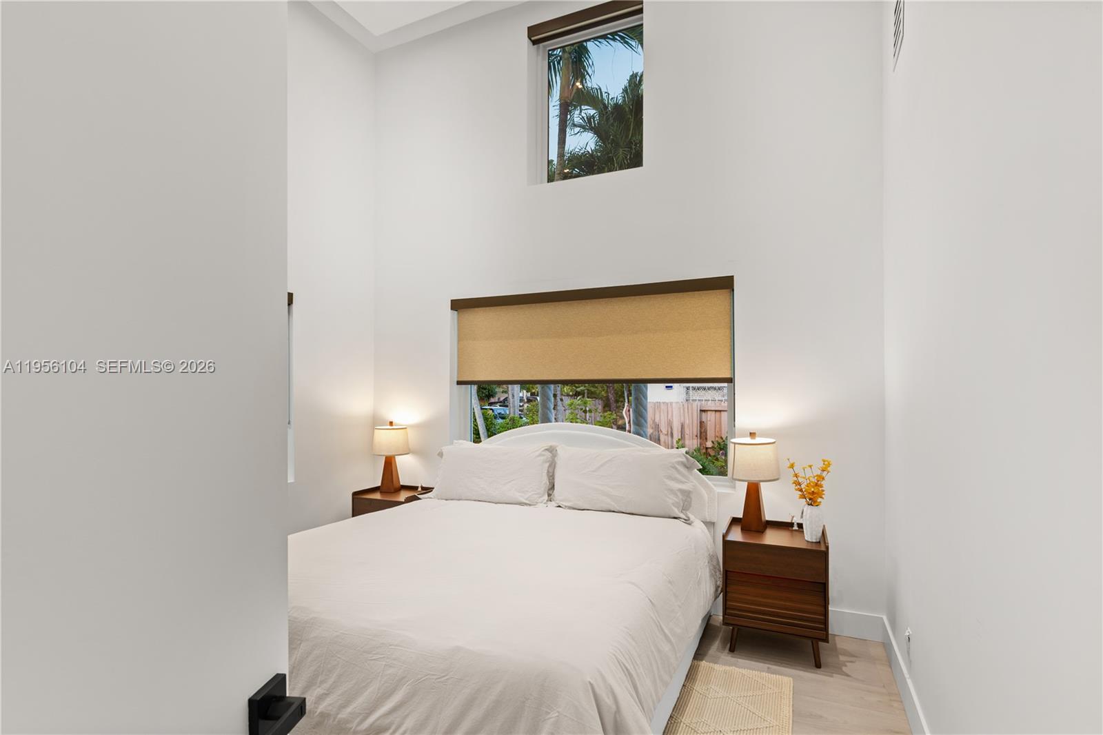 3616 Southwest 26th Street Miami, FL 33133 - Photo 50 of 77 a bedroom with a bed and a window