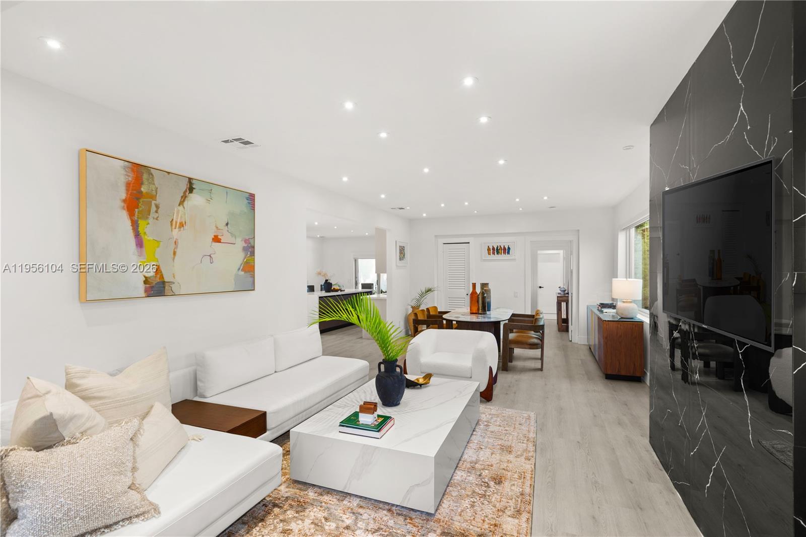 3616 Southwest 26th Street Miami, FL 33133 - Photo 6 of 77 a living room with furniture and a flat screen tv