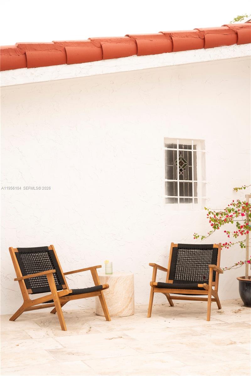 3616 Southwest 26th Street Miami, FL 33133 - Photo 64 of 77 a living room with a couch and a potted plant