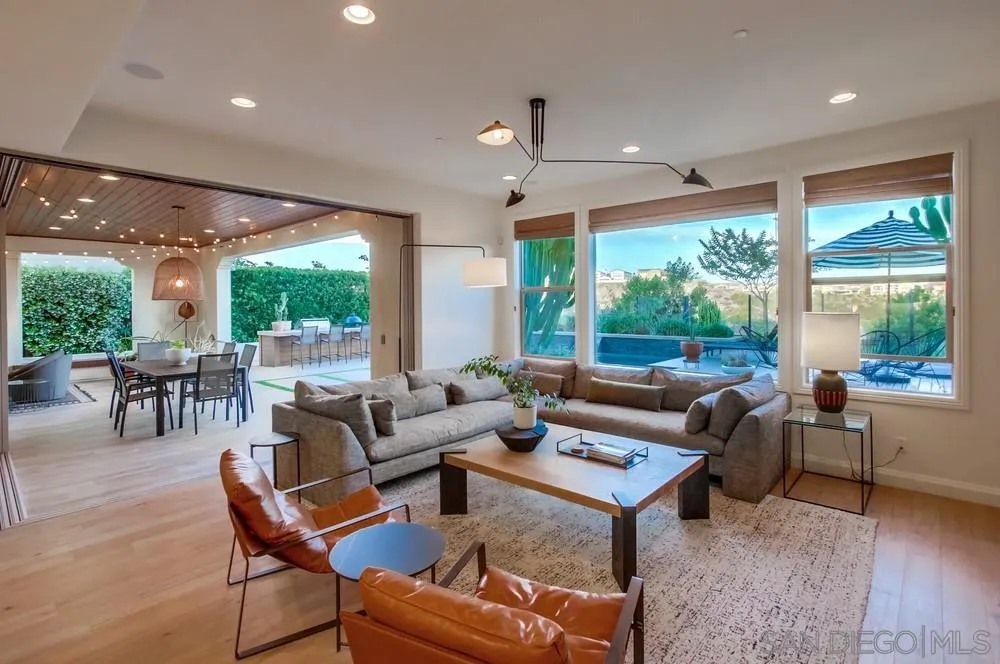 15497 Tanner Ridge Road San Diego, CA 92127 - Photo 19 of 48 a living room with furniture and large windows