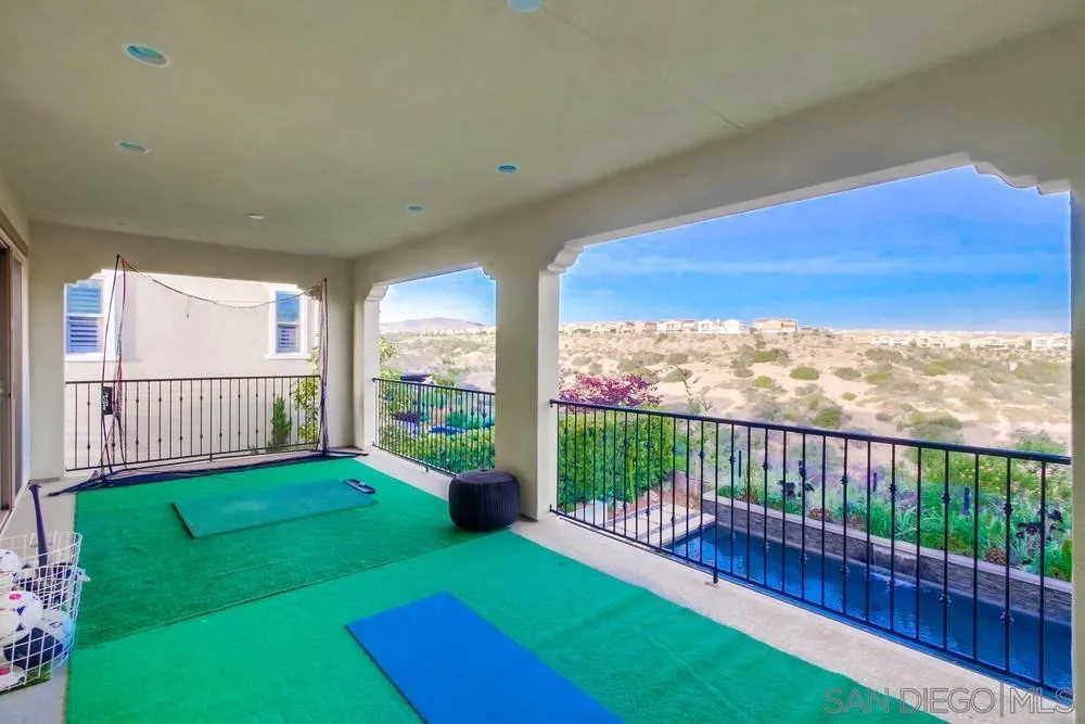 15497 Tanner Ridge Road San Diego, CA 92127 - Photo 29 of 48 a view of a balcony with floor to ceiling windows with wooden roof