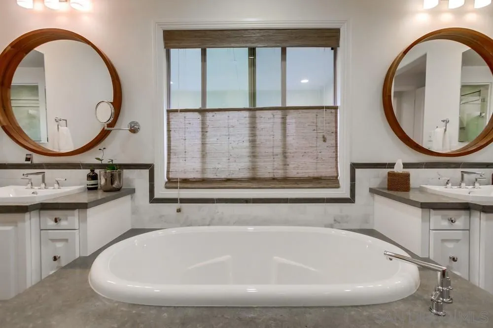 15497 Tanner Ridge Road San Diego, CA 92127 - Photo 36 of 48 a bathroom with a tub sink and mirror