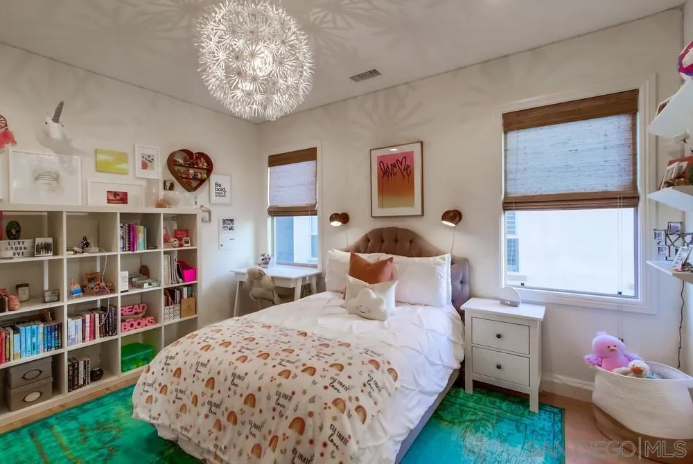 15497 Tanner Ridge Road San Diego, CA 92127 - Photo 38 of 48 a bedroom that has a bed and a bookshelf in it