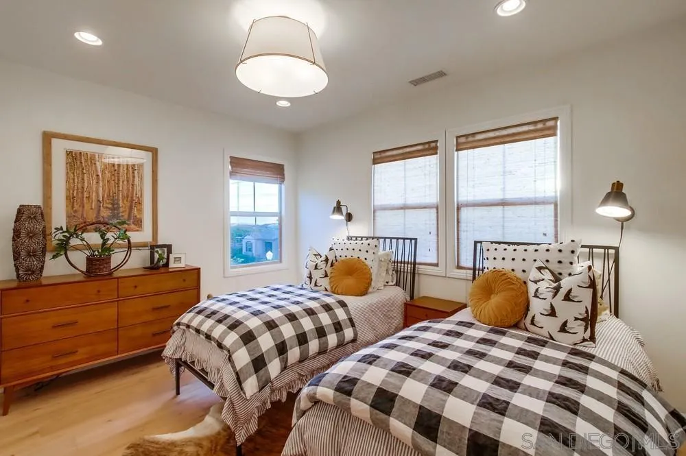 15497 Tanner Ridge Road San Diego, CA 92127 - Photo 39 of 48 a bedroom with two beds and potted plant