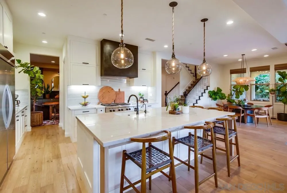 15497 Tanner Ridge Road San Diego, CA 92127 - Photo 4 of 48 a kitchen with a table and chairs in it