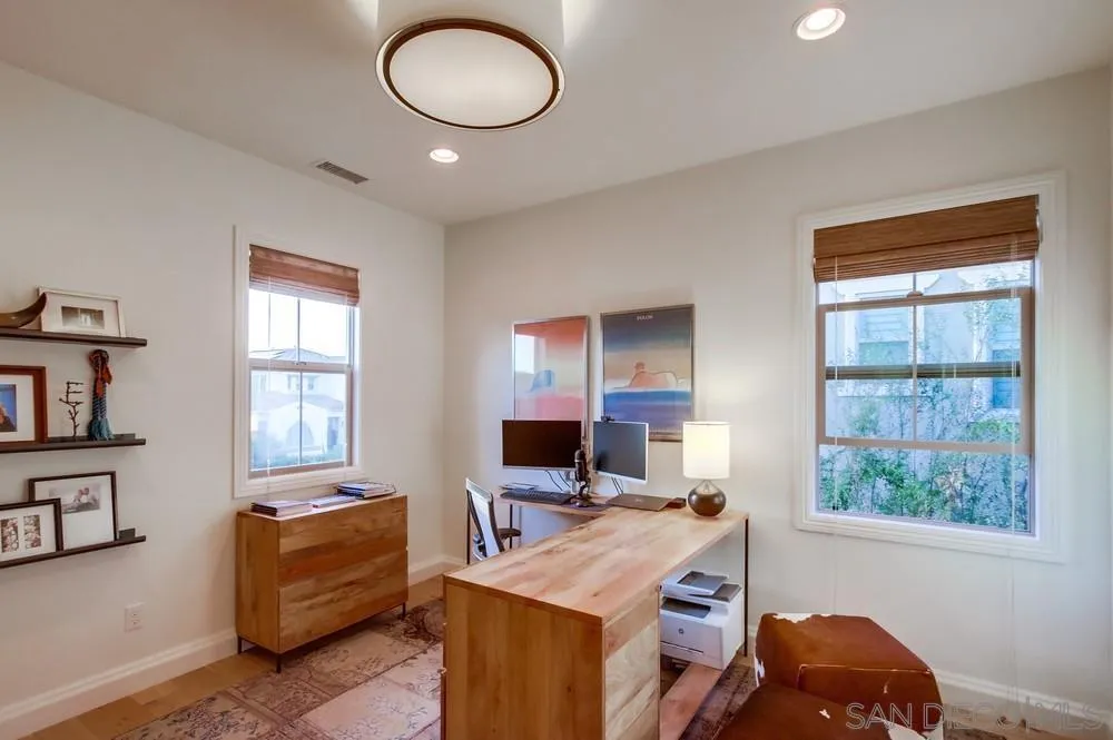 15497 Tanner Ridge Road San Diego, CA 92127 - Photo 43 of 48 a living room with furniture and a flat screen tv