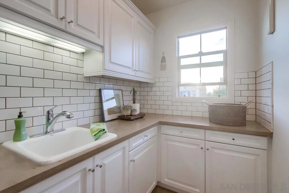 15497 Tanner Ridge Road San Diego, CA 92127 - Photo 45 of 48 a kitchen with a sink cabinets and window