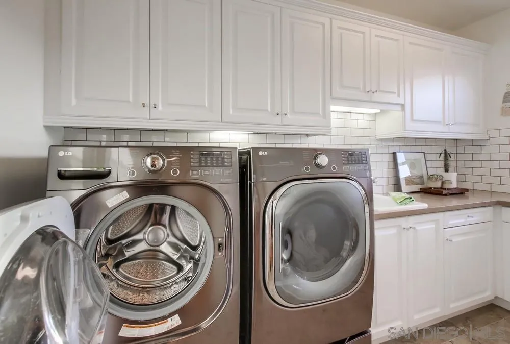 15497 Tanner Ridge Road San Diego, CA 92127 - Photo 46 of 48 a utility room with dryer and washer