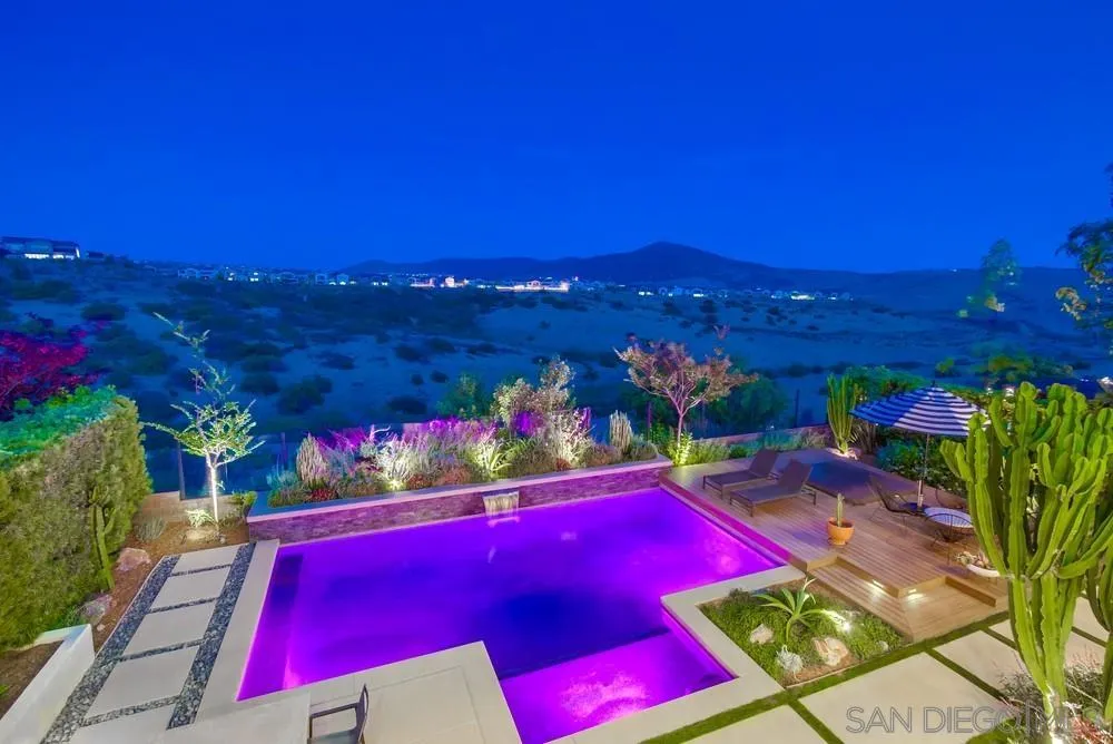 15497 Tanner Ridge Road San Diego, CA 92127 - Photo 47 of 48 a view of swimming pool with lawn chairs and potted plants