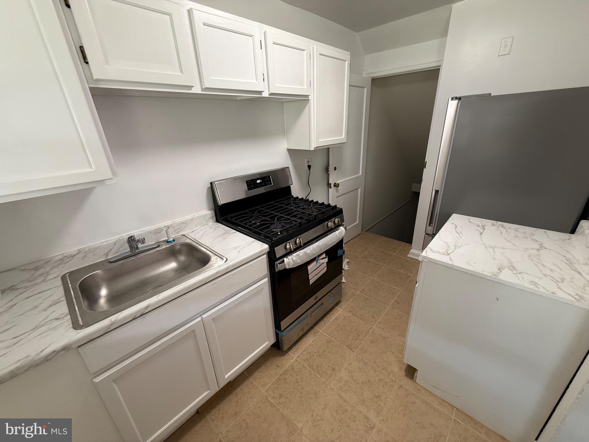374 Chaplin Street Southeast Washington, DC 20019 - Photo 18 of 23 a utility room with sink dryer and washer