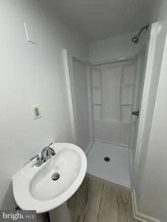 a bathroom with a sink and shower