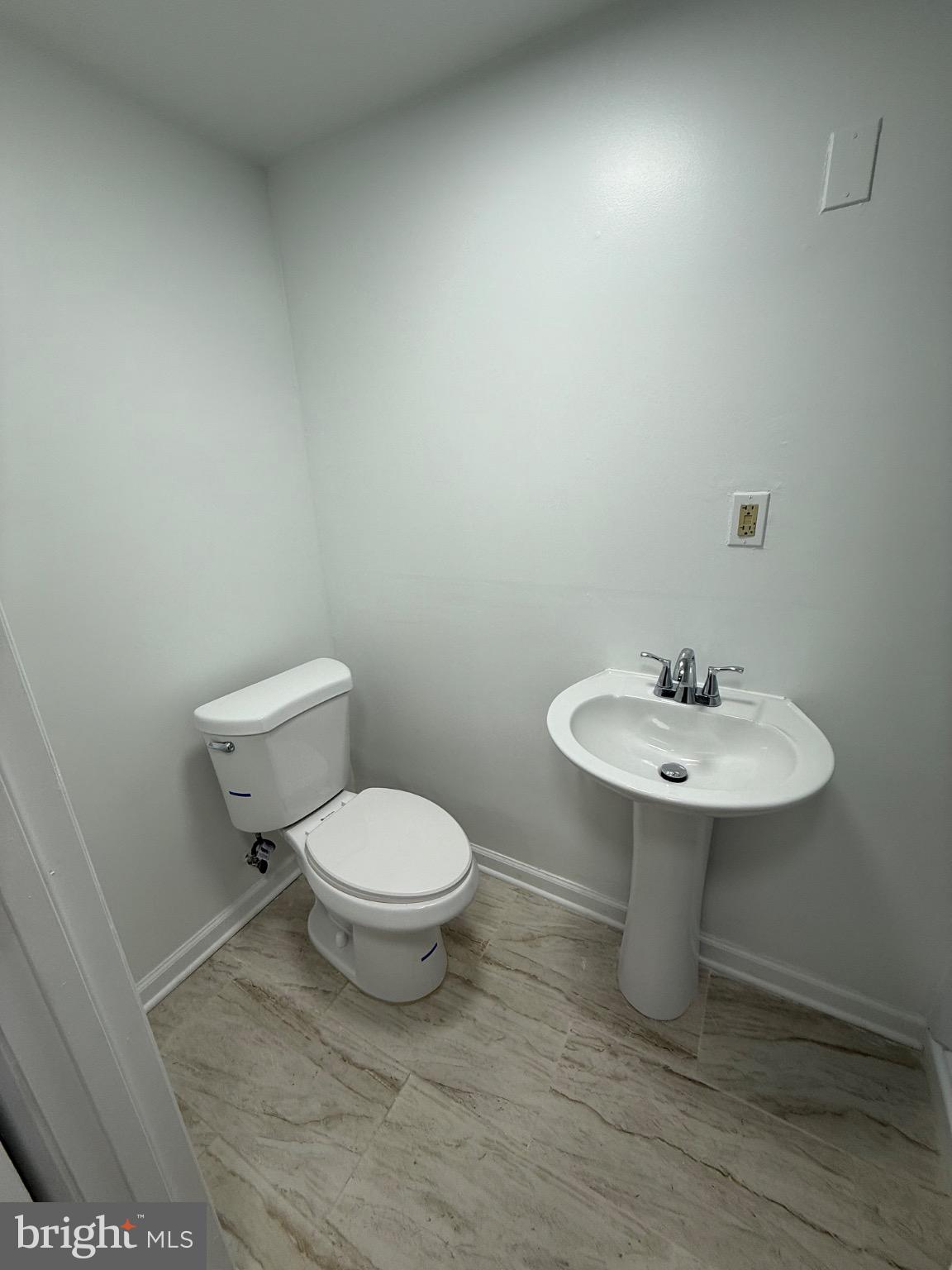 374 Chaplin Street Southeast Washington, DC 20019 - Photo 23 of 23 a bathroom with a sink a toilet and mirror