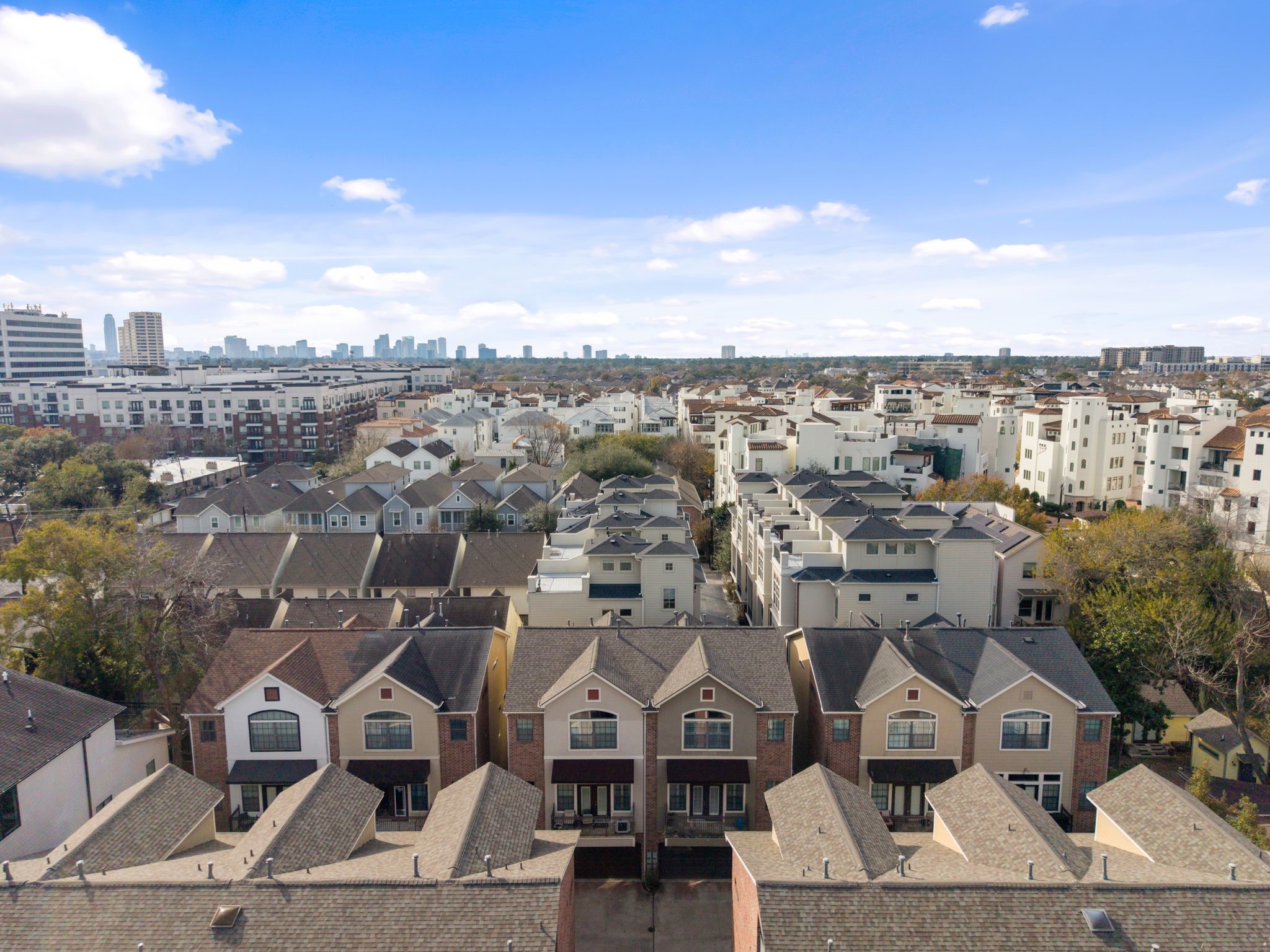 This aerial photo showcases the neighborhood surrounded by trees. Within one mile from Memorial Park and River Oaks.