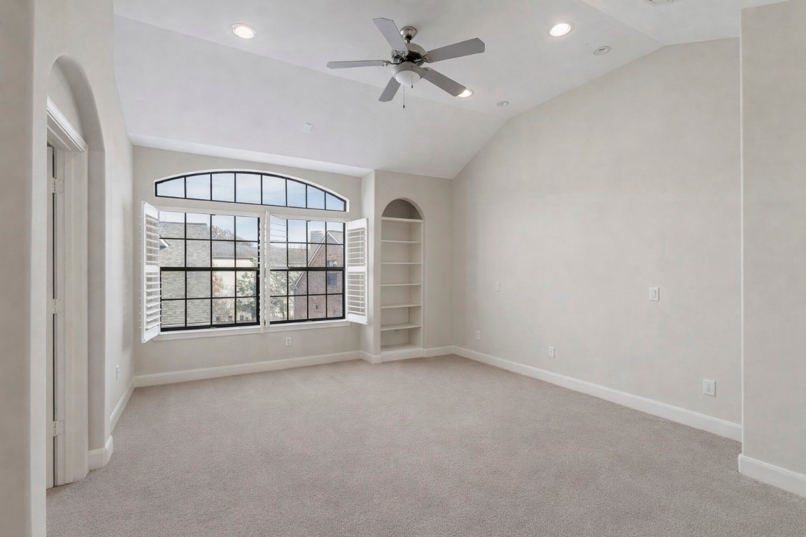 121 Roy Street Houston, TX 77007 - Photo 12 of 33 an empty room with chandelier fan and windows