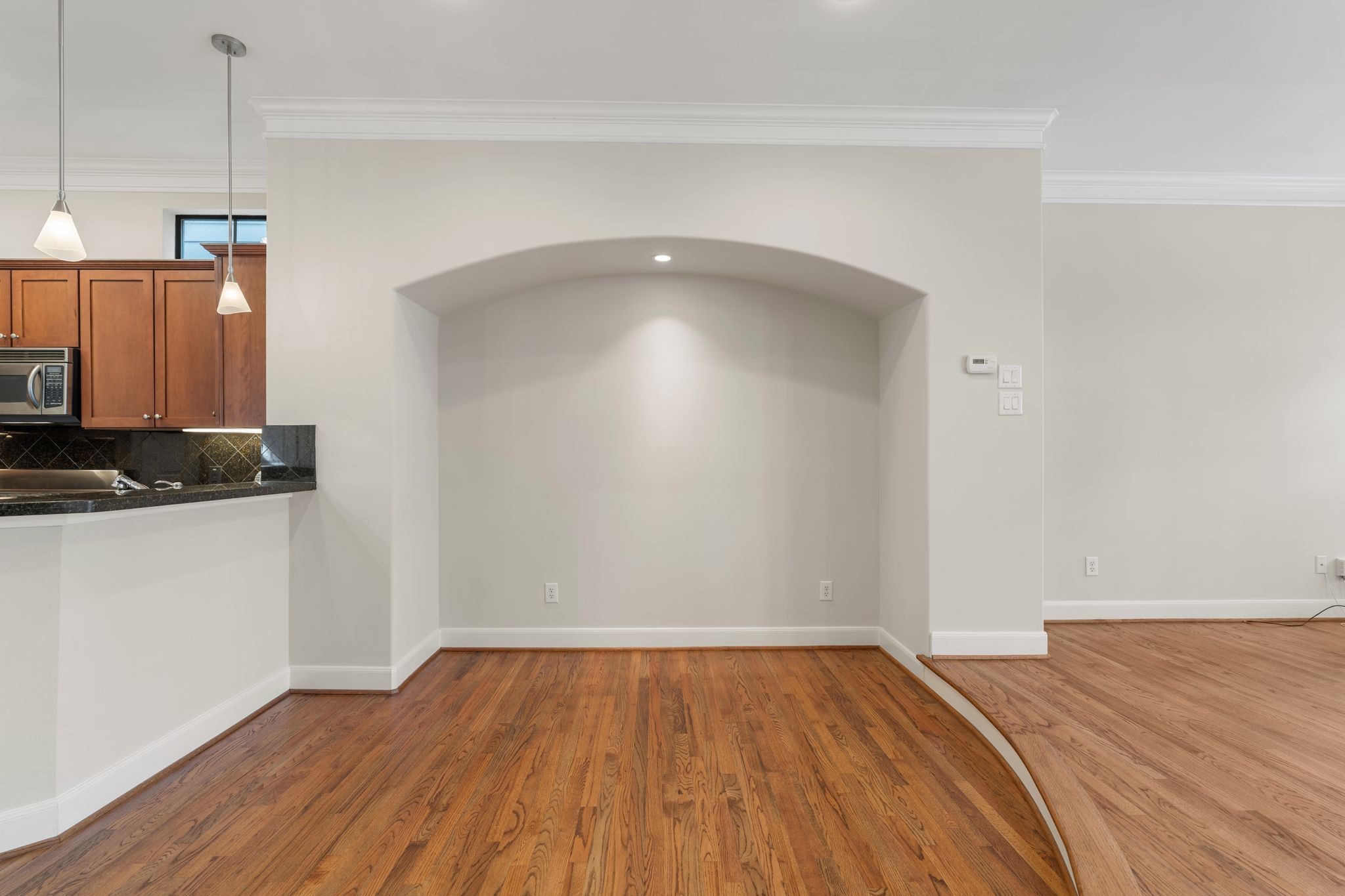121 Roy Street Houston, TX 77007 - Photo 5 of 29 The arched alcove with recessed lighting provides a nice open space for a dinning table.