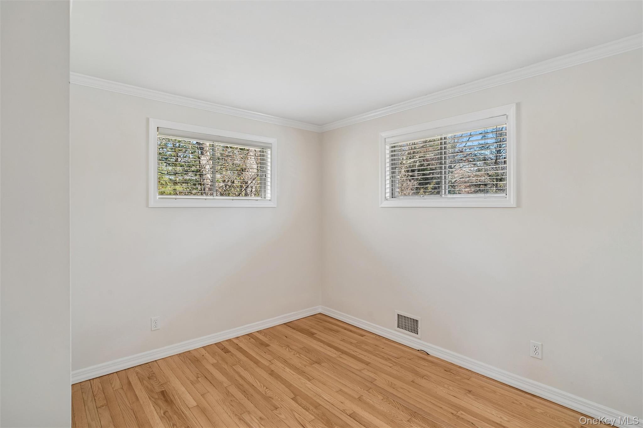 58 Old Depot Road Quogue, NY 11959 - Photo 13 of 28 an empty room with a window