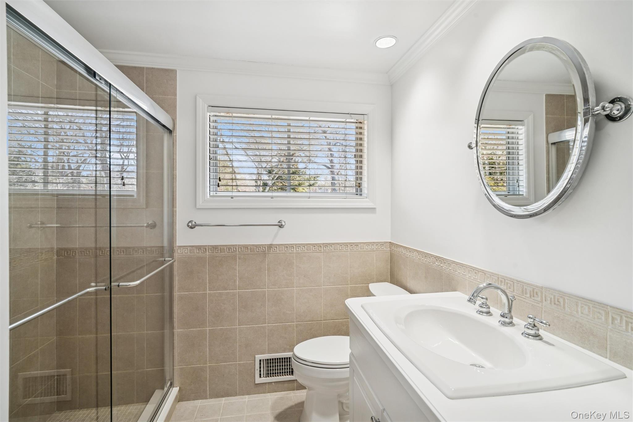 58 Old Depot Road Quogue, NY 11959 - Photo 14 of 28 a bathroom with a toilet a sink and a mirror