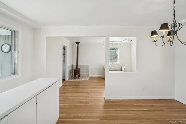 a view of an entryway with wooden floor