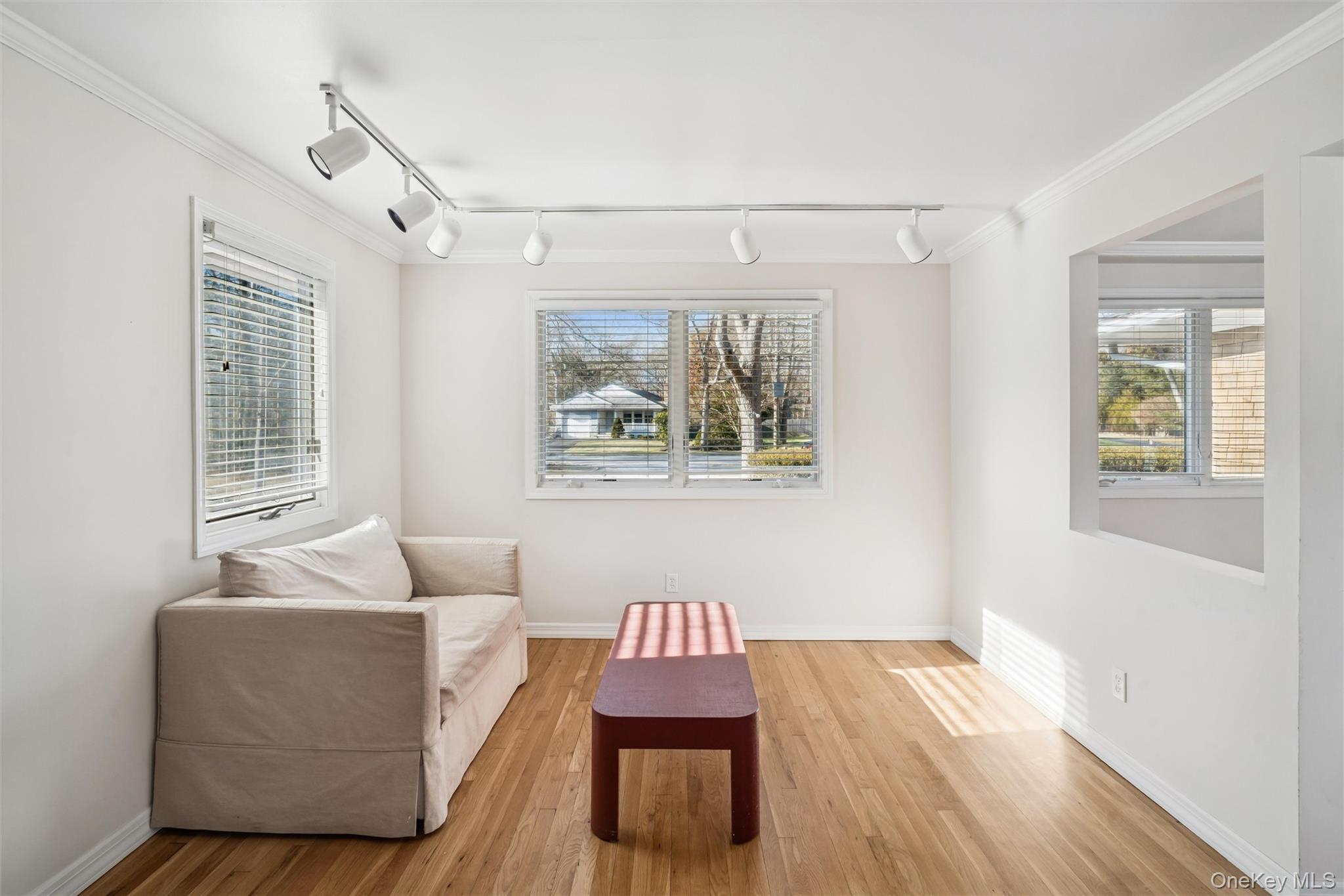 58 Old Depot Road Quogue, NY 11959 - Photo 8 of 28 a living room with furniture and a window