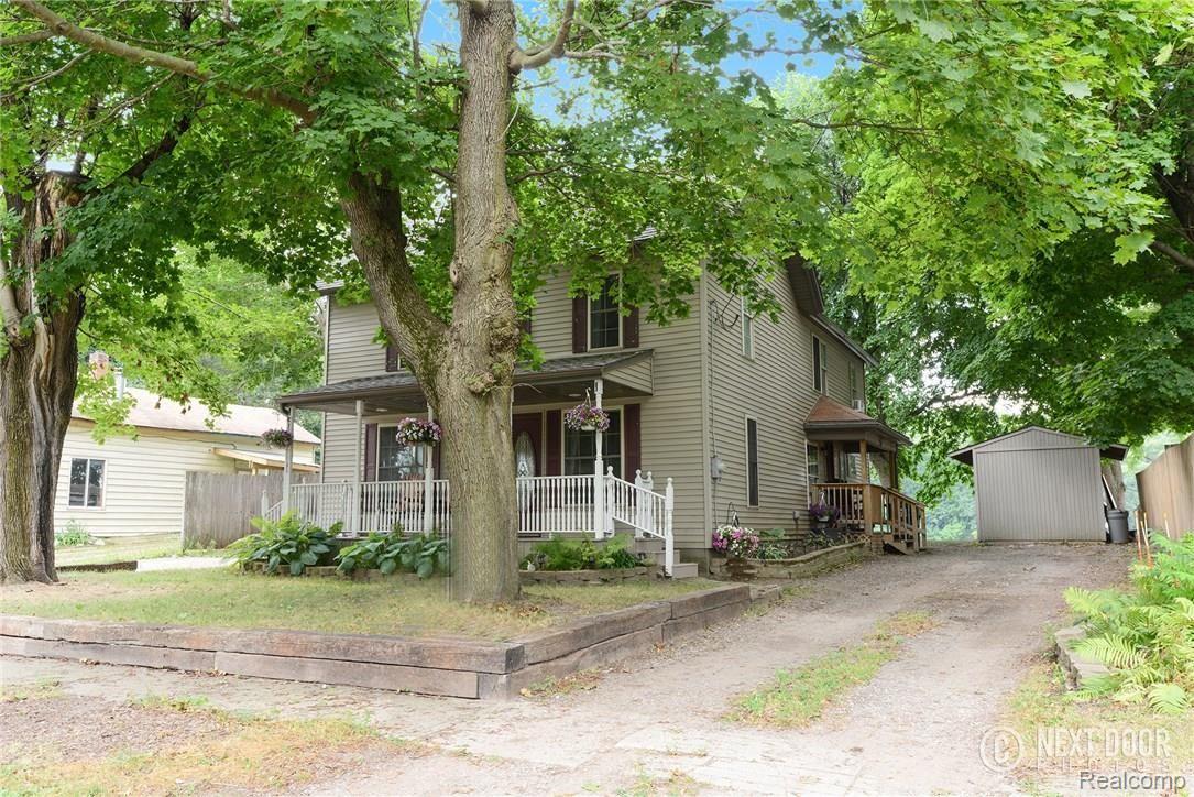 1426 Faussett Road Howell, MI 48855 - Photo 1 of 28 Remodeled Farm house style home with 2 covered porches and 2 drive ways (drives on each side of home)
