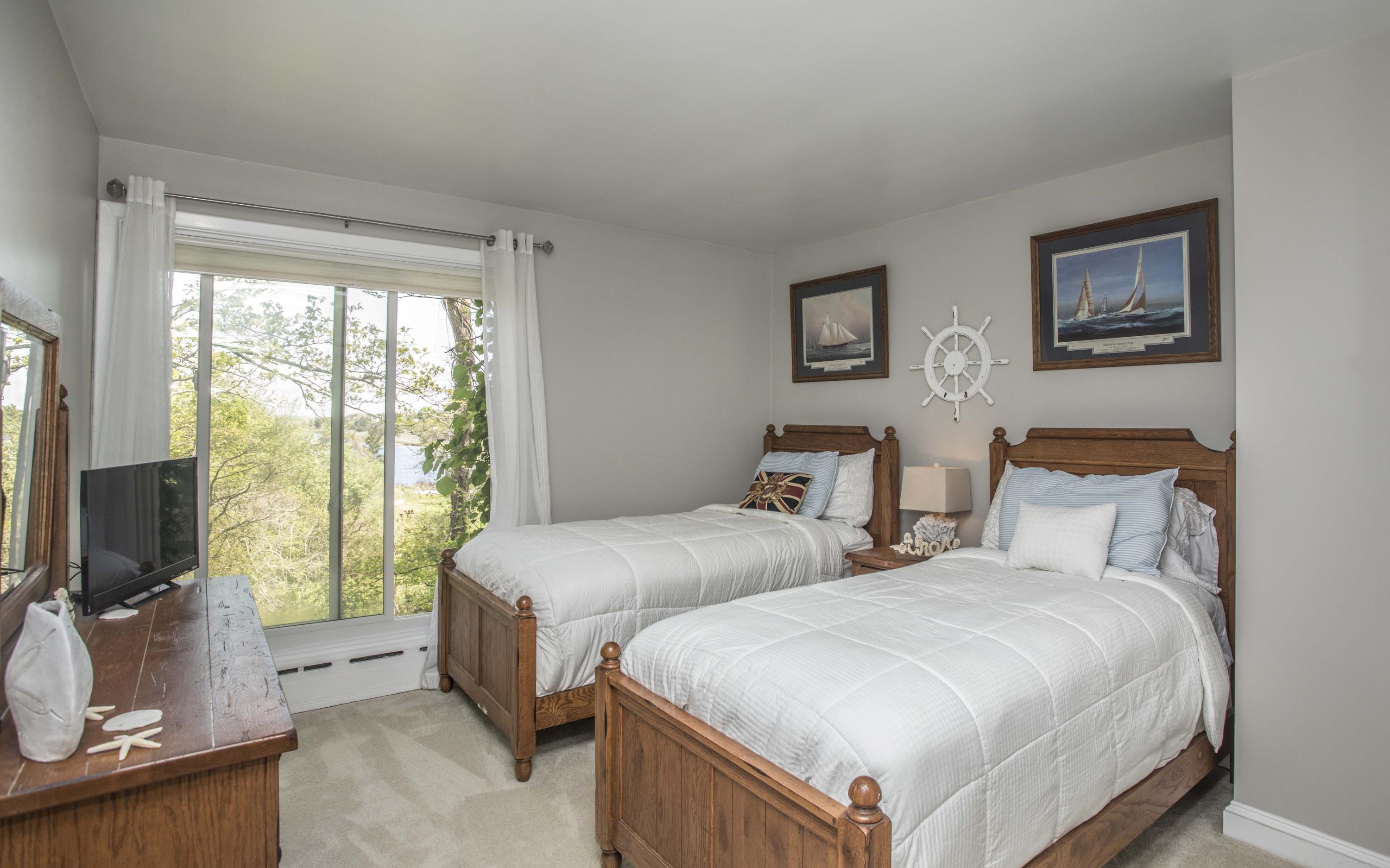 14 Ridge Road North Falmouth, MA 02556 - Photo 11 of 22 a bedroom with two beds and a flat screen tv