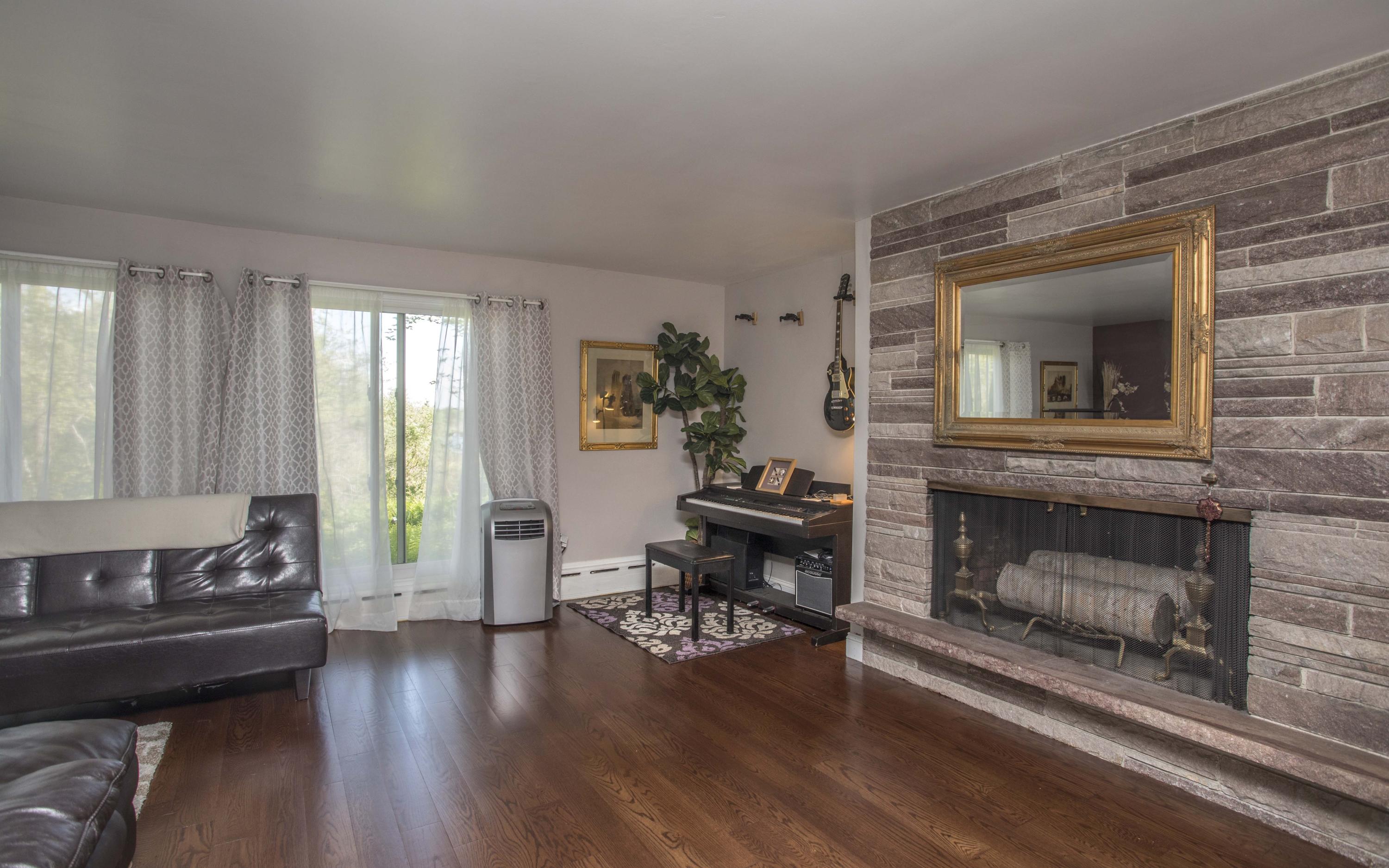 14 Ridge Road North Falmouth, MA 02556 - Photo 13 of 22 a living room with furniture and a fireplace