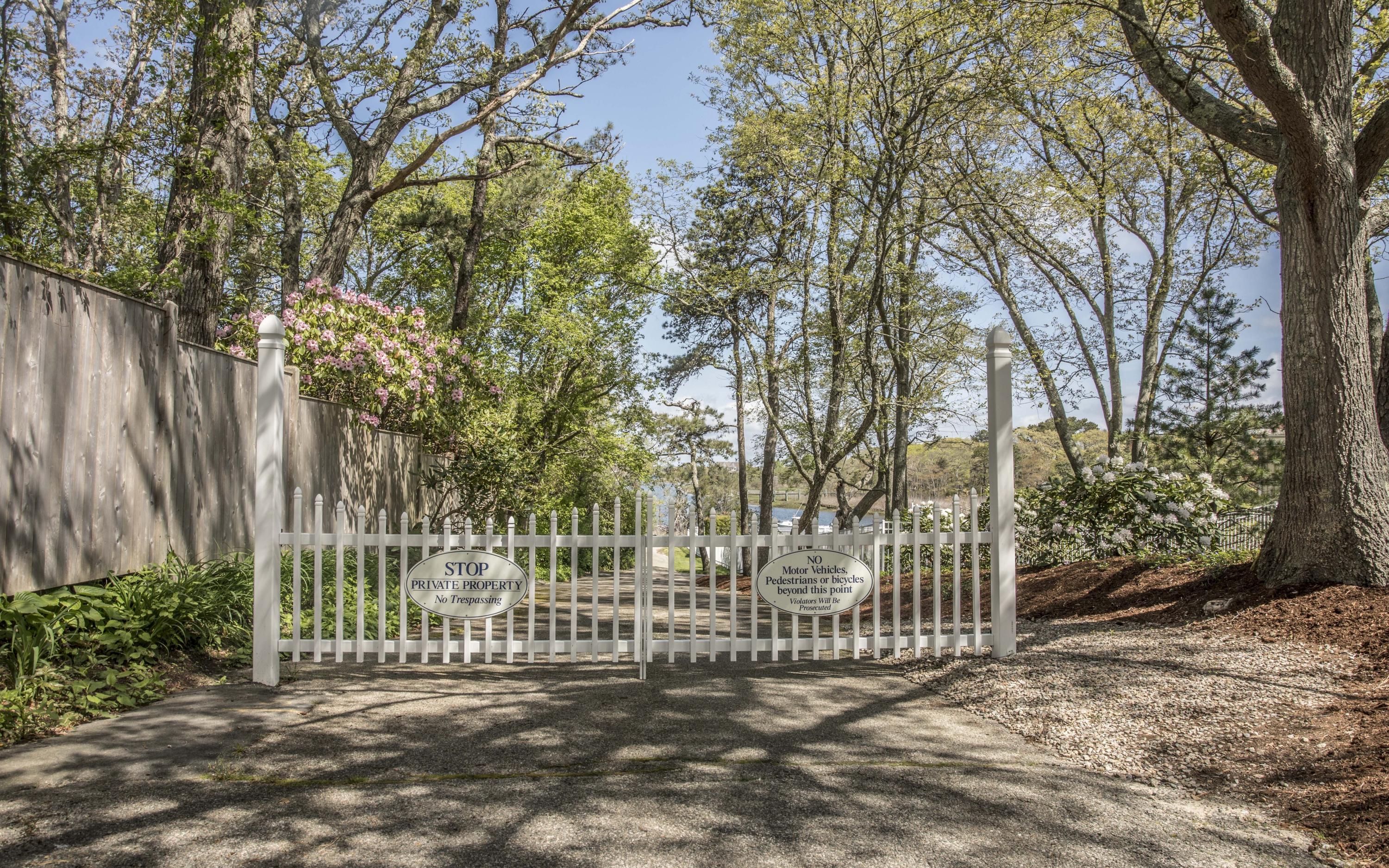 14 Ridge Road North Falmouth, MA 02556 - Photo 15 of 22 a view of a white house with a small yard and plants