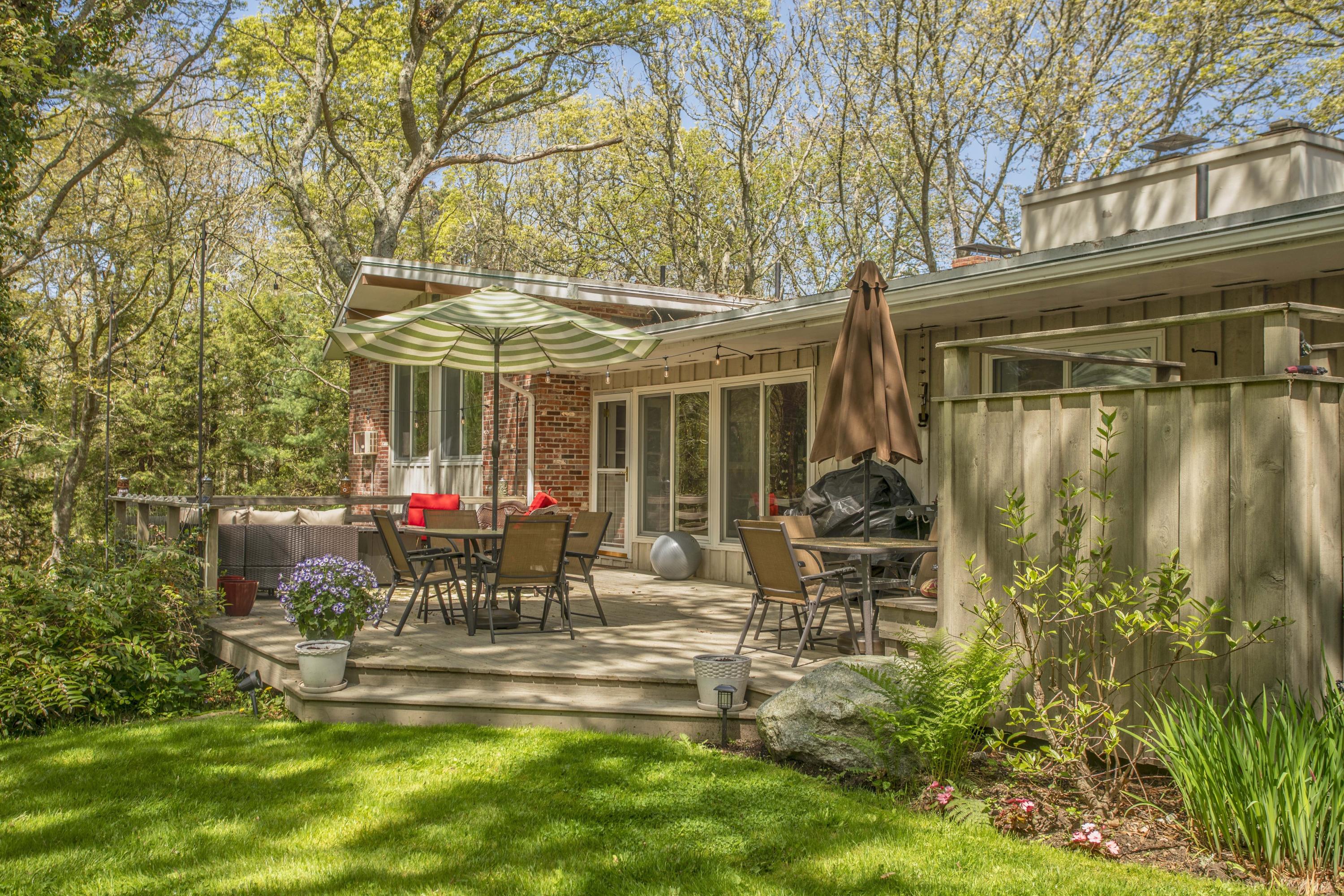14 Ridge Road North Falmouth, MA 02556 - Photo 17 of 22 a view of a house with backyard sitting area and garden