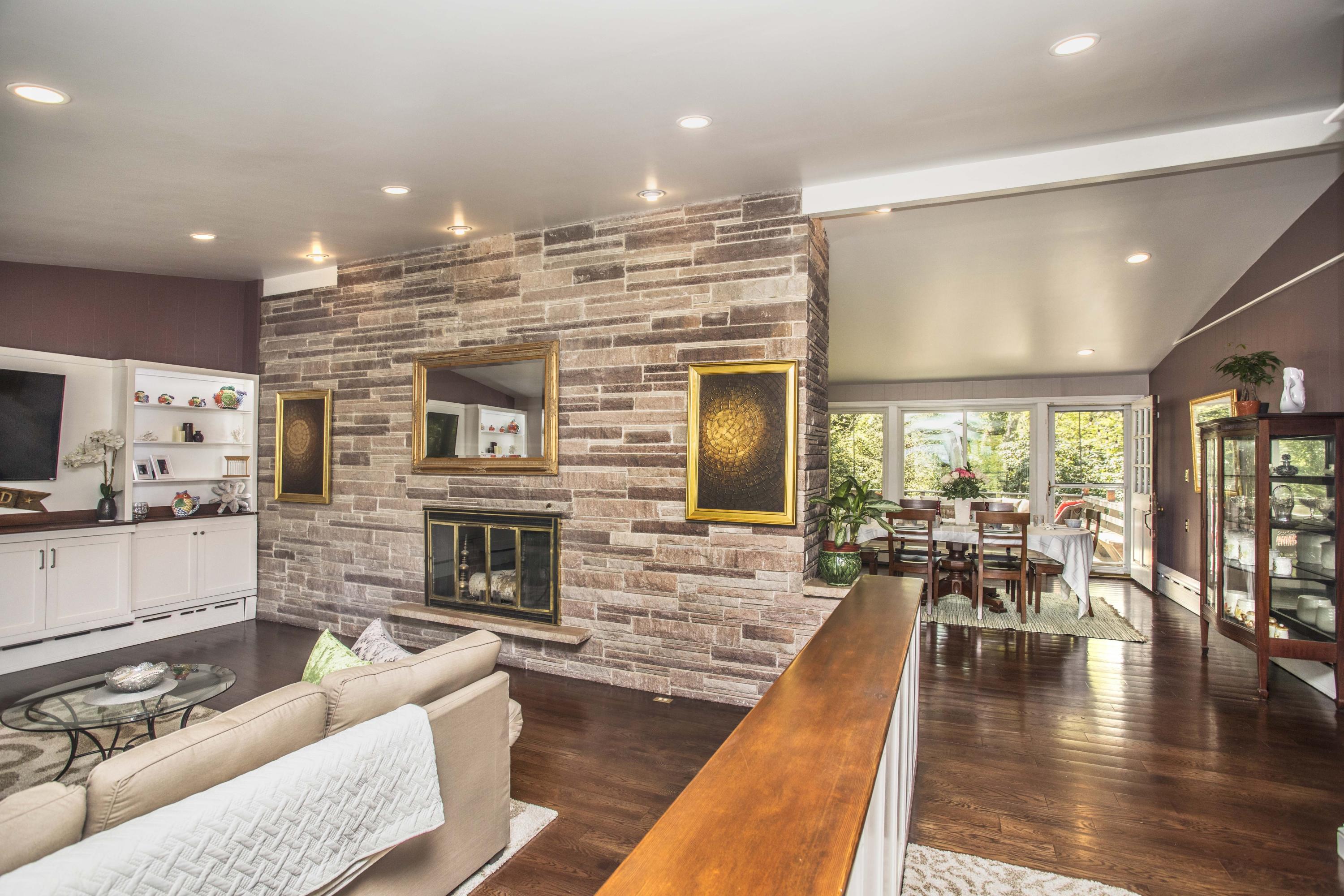 14 Ridge Road North Falmouth, MA 02556 - Photo 6 of 22 a living room with fireplace furniture kitchen view and a large window