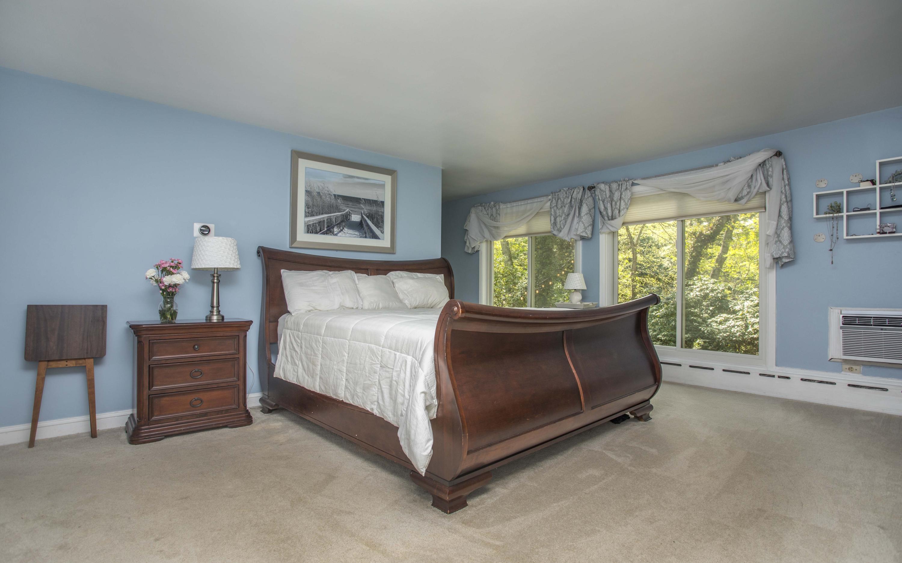 14 Ridge Road North Falmouth, MA 02556 - Photo 9 of 22 a bed room with a bed and a chair