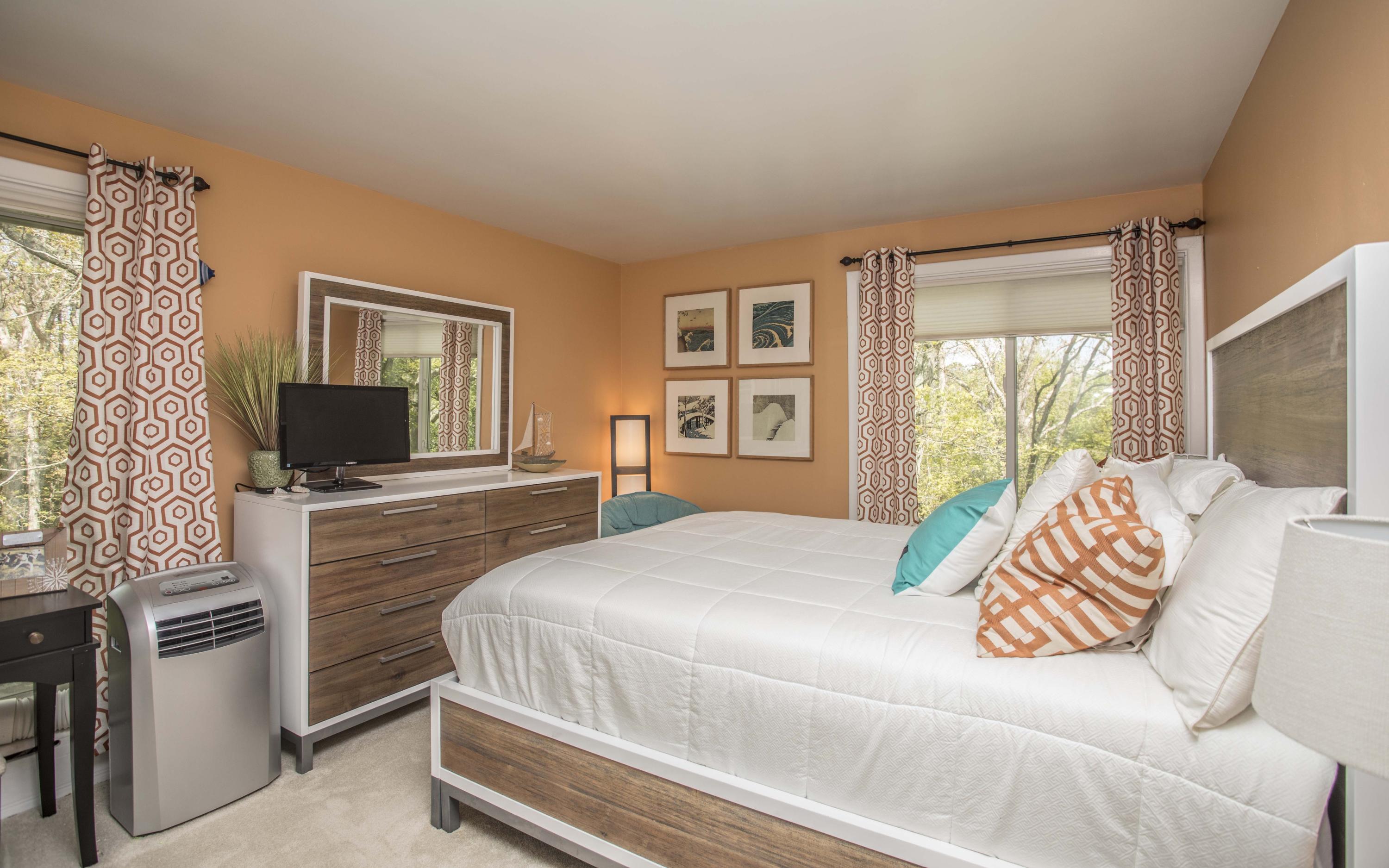 14 Ridge Road North Falmouth, MA 02556 - Photo 10 of 22 a bedroom with a bed and a flat screen tv