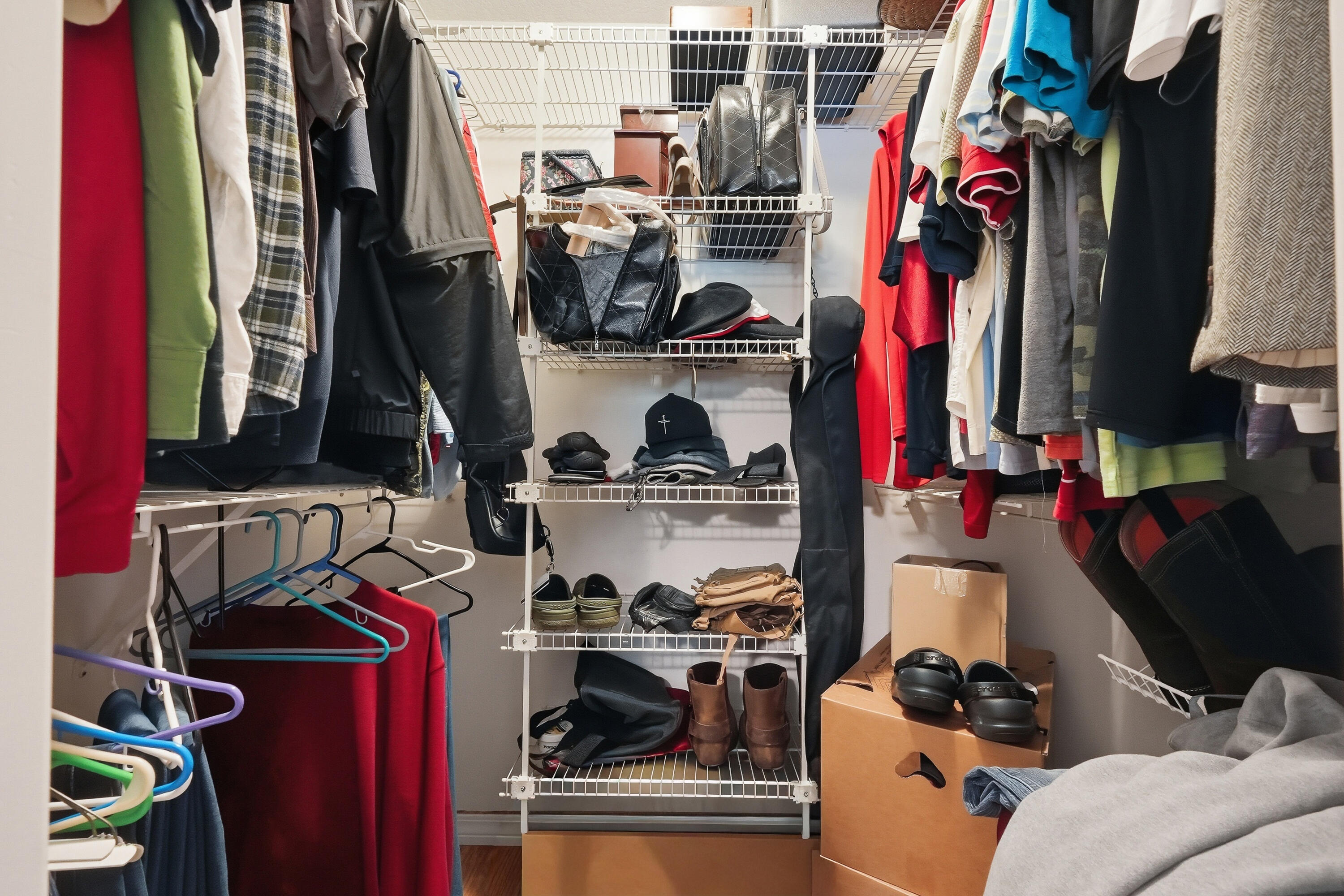 4237 Melton Road Milton, FL 32583 - Photo 23 of 43 a view of walk in closet with clothes and shoes
