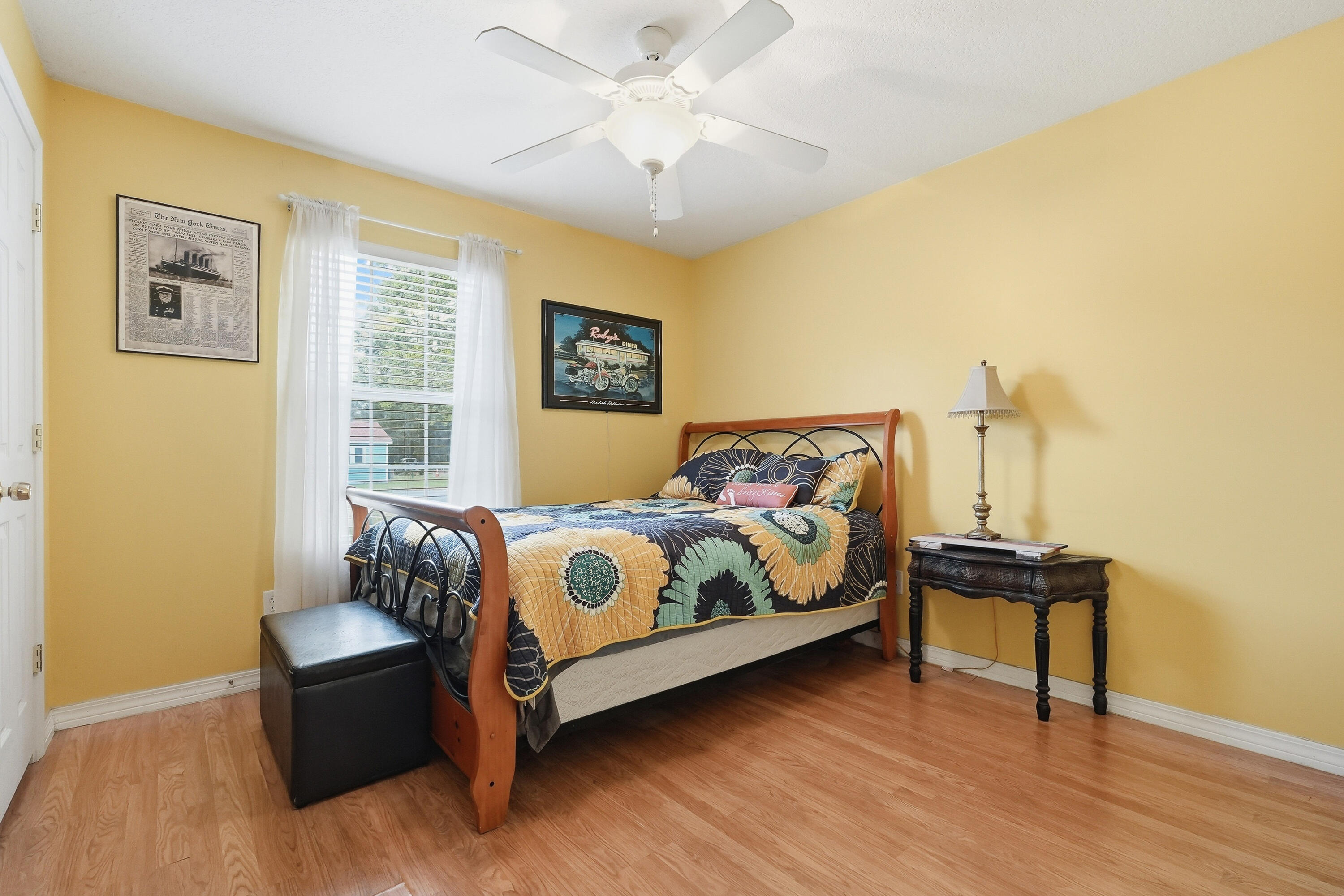 4237 Melton Road Milton, FL 32583 - Photo 25 of 43 a bedroom with a bed and wooden floor