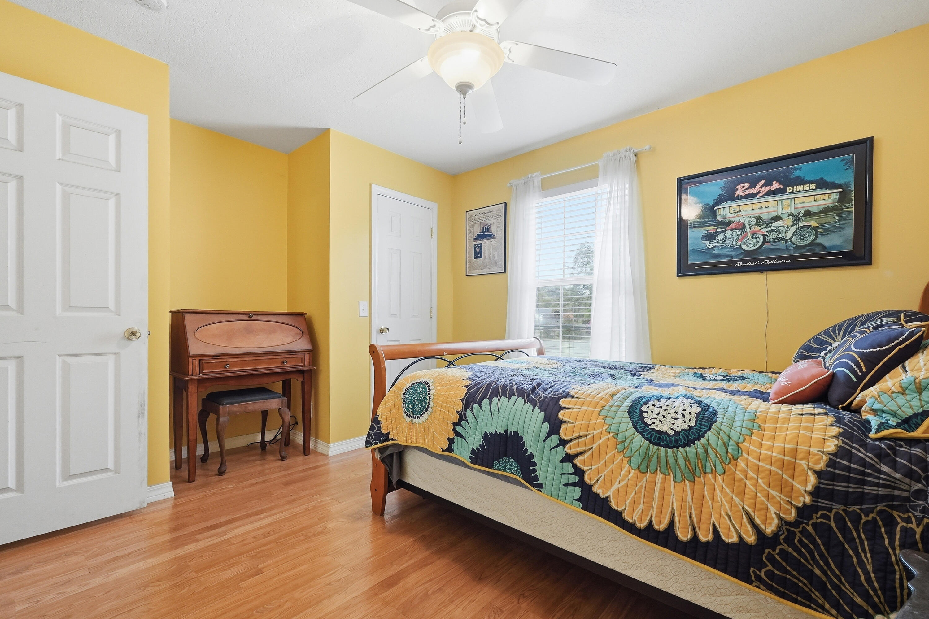 4237 Melton Road Milton, FL 32583 - Photo 26 of 43 a bedroom with bed and a fireplace
