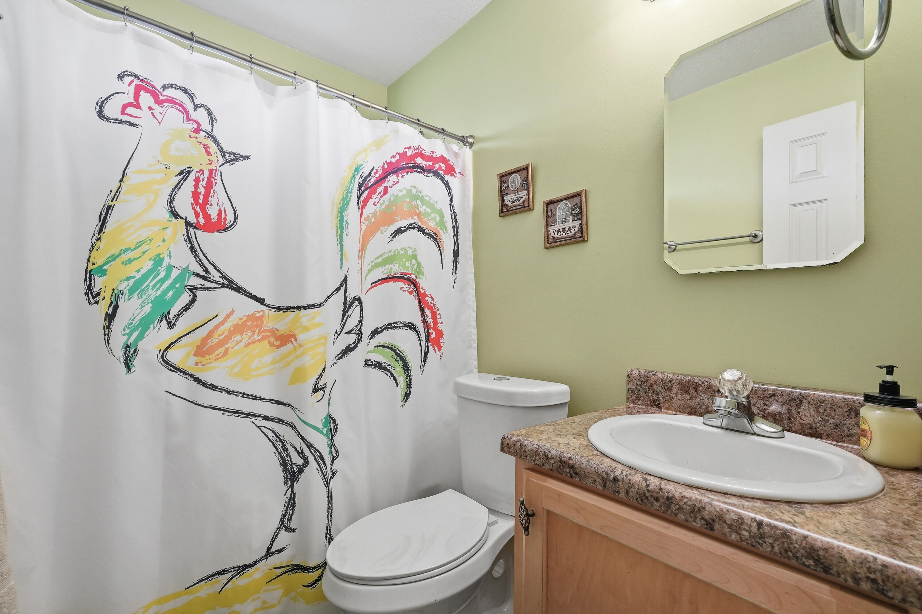 4237 Melton Road Milton, FL 32583 - Photo 27 of 43 a bathroom with a granite countertop sink mirror vanity and toilet