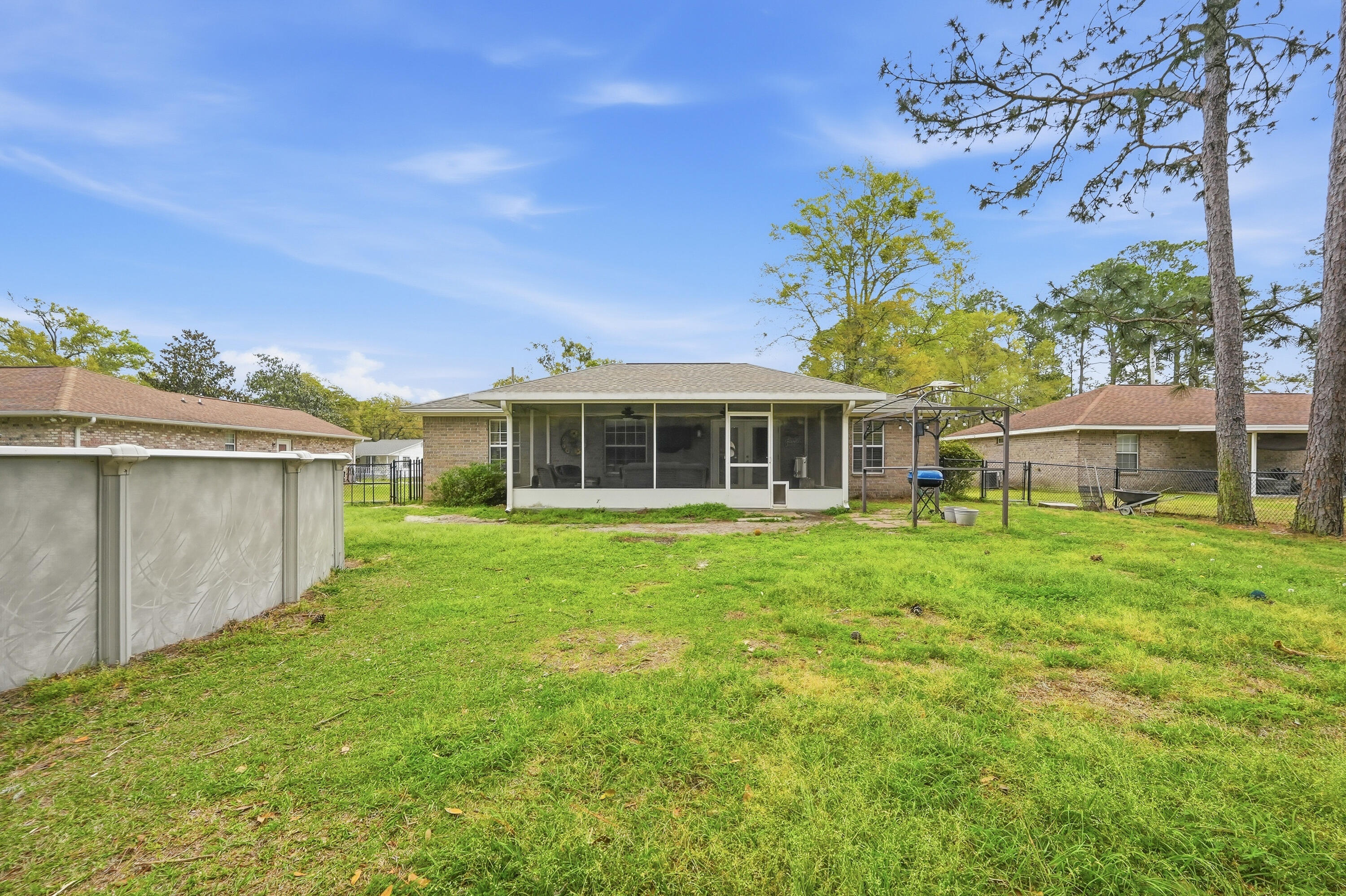 4237 Melton Road Milton, FL 32583 - Photo 37 of 43 a front view of a house with a garden