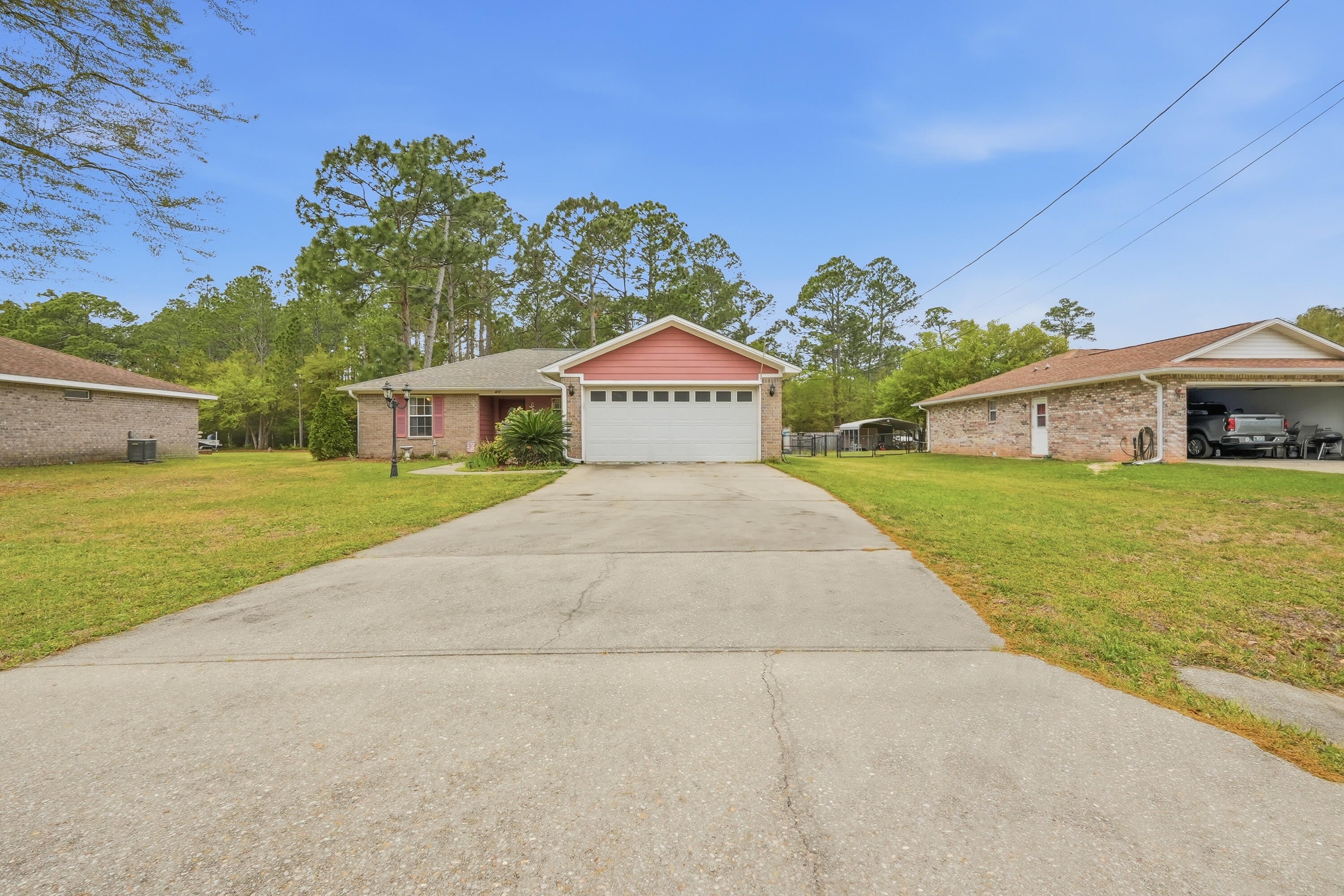 4237 Melton Road Milton, FL 32583 - Photo 4 of 43 a view of a house with garden and yard