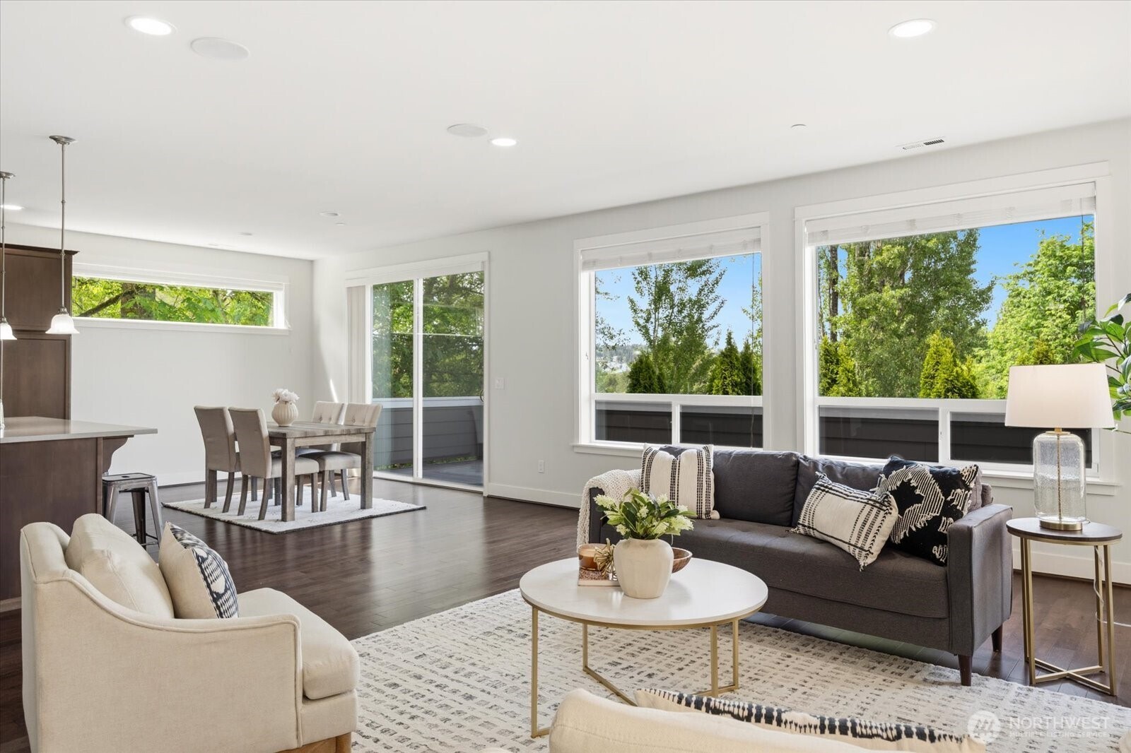 12102 Northeast 174th Street, Unit 1 Bothell, WA 98011 - Photo 13 of 40 a living room with furniture and a large window