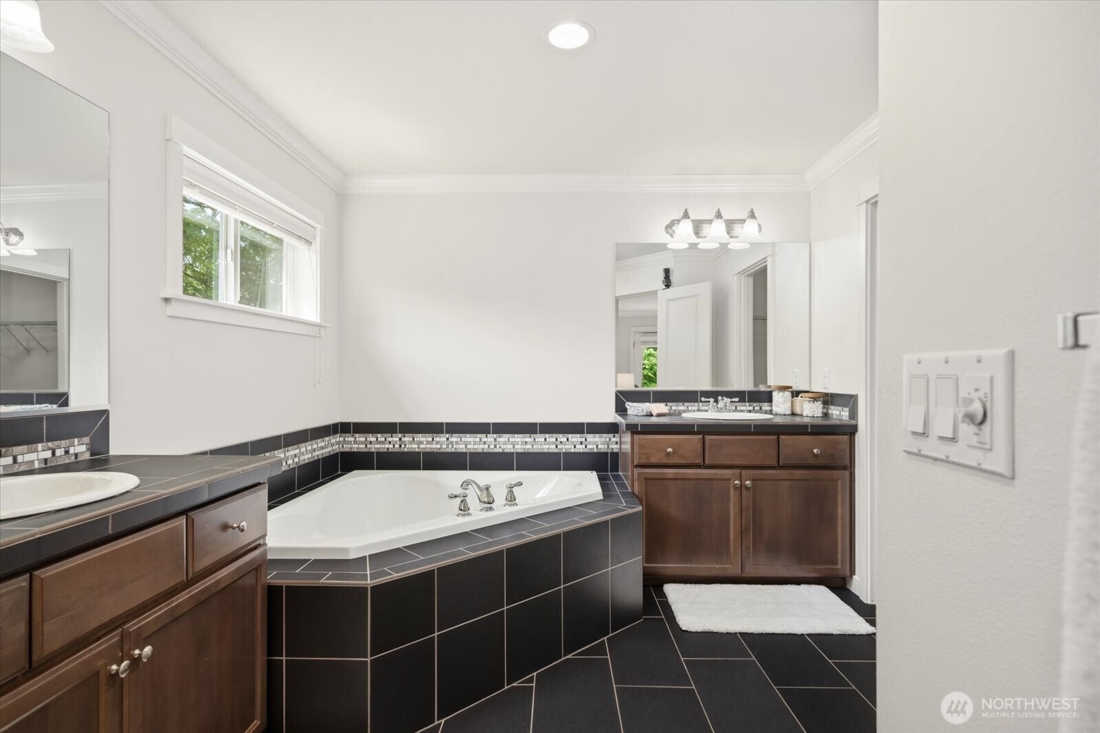12102 Northeast 174th Street, Unit 1 Bothell, WA 98011 - Photo 19 of 40 a bathroom with a sink a toilet and mirror