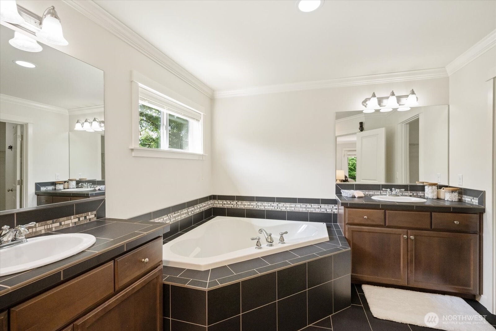 12102 Northeast 174th Street, Unit 1 Bothell, WA 98011 - Photo 20 of 40 a bathroom with a granite countertop sink a toilet and mirror