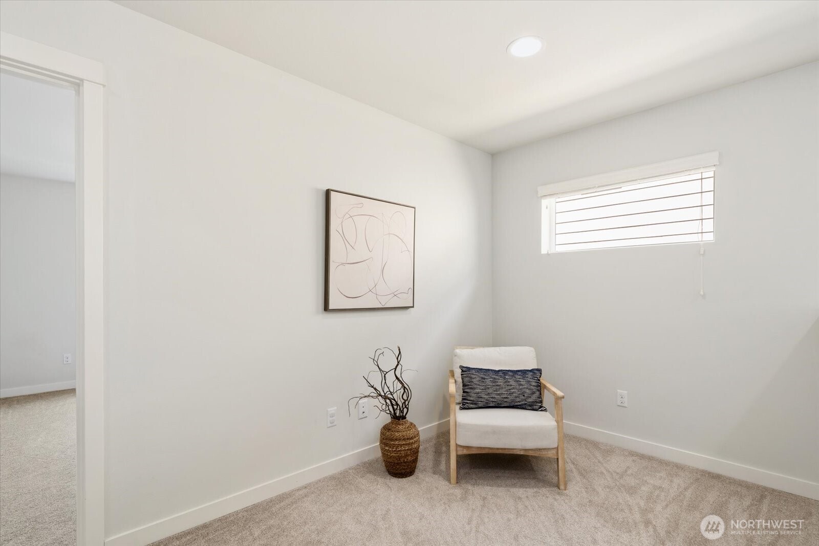 12102 Northeast 174th Street, Unit 1 Bothell, WA 98011 - Photo 25 of 40 a hallway with a couch and a window