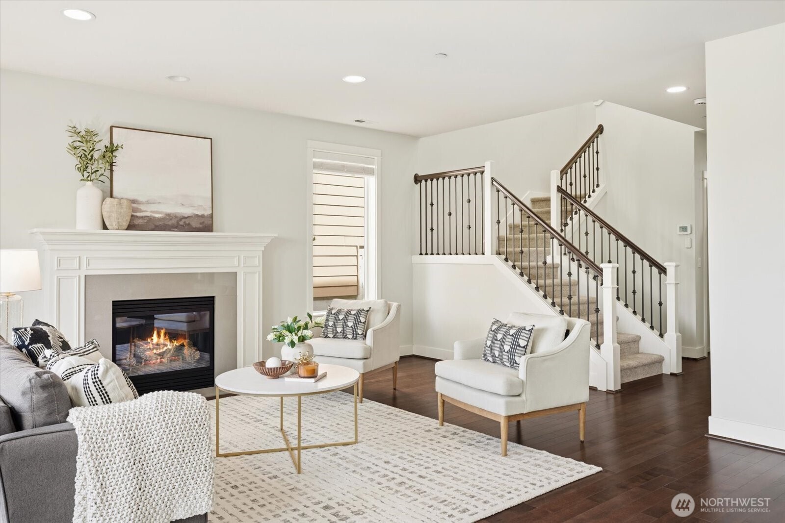 12102 Northeast 174th Street, Unit 1 Bothell, WA 98011 - Photo 5 of 40 a living room with furniture and a fireplace